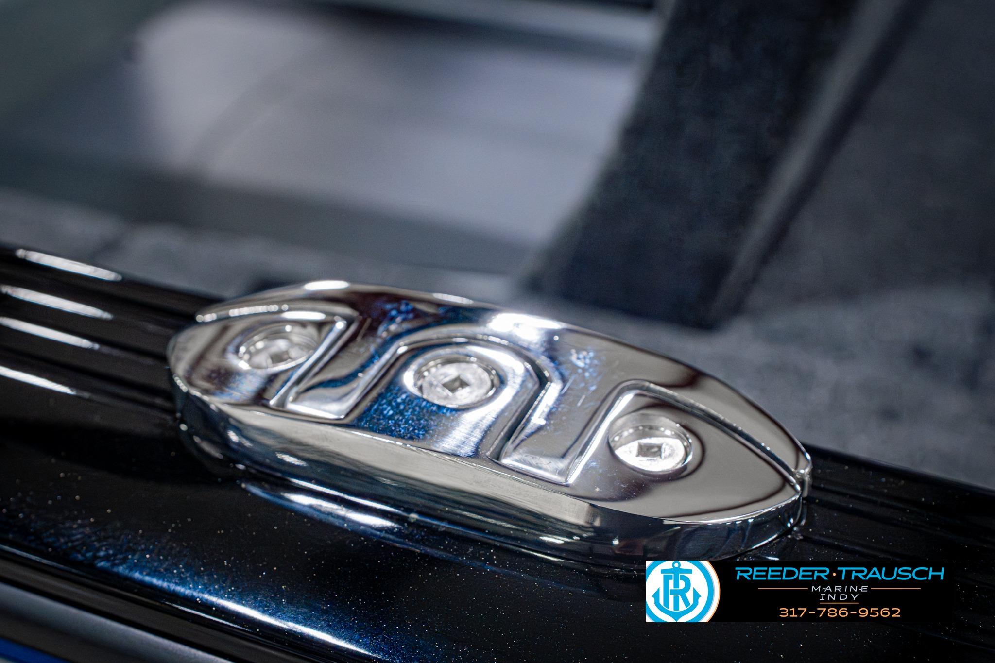 Close-up of a 2026 Lund 1775 Impact XS SS boat detail with chrome hardware.