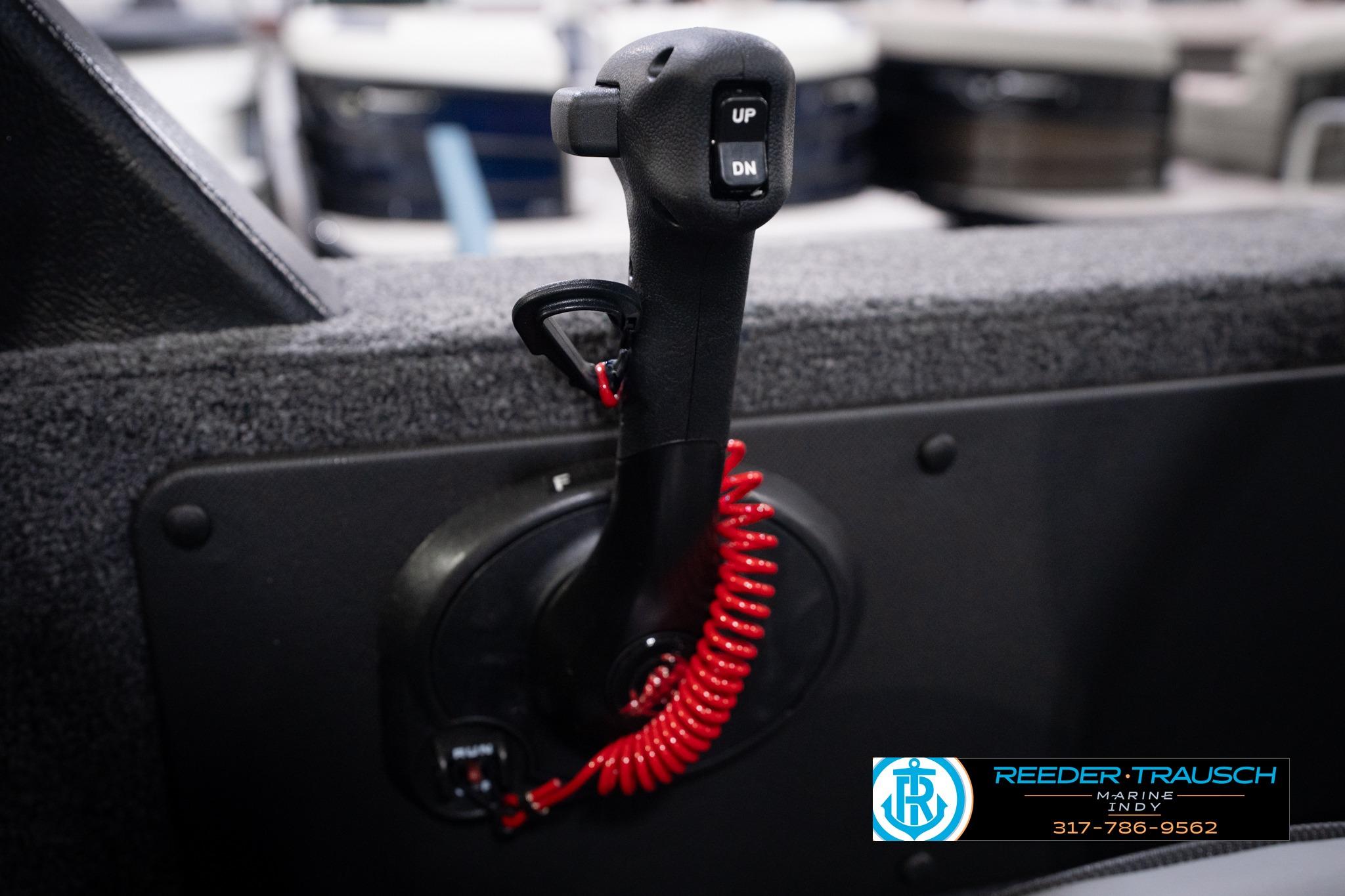 Control lever in a 2026 Lund 1775 Impact XS SS boat, featuring up and down buttons.