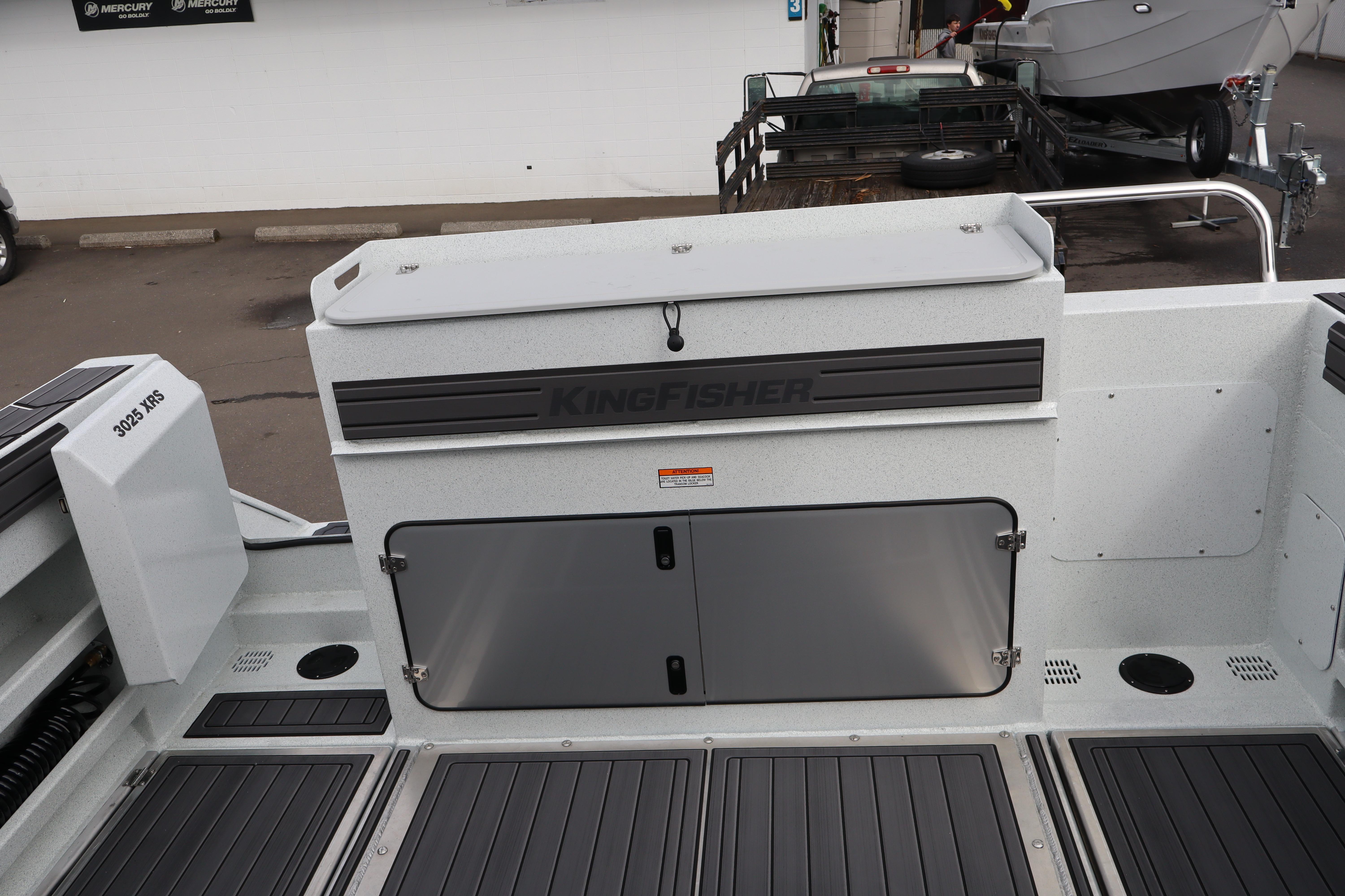 2026 KingFisher 3025 XRS boat interior with storage compartments and sleek design.