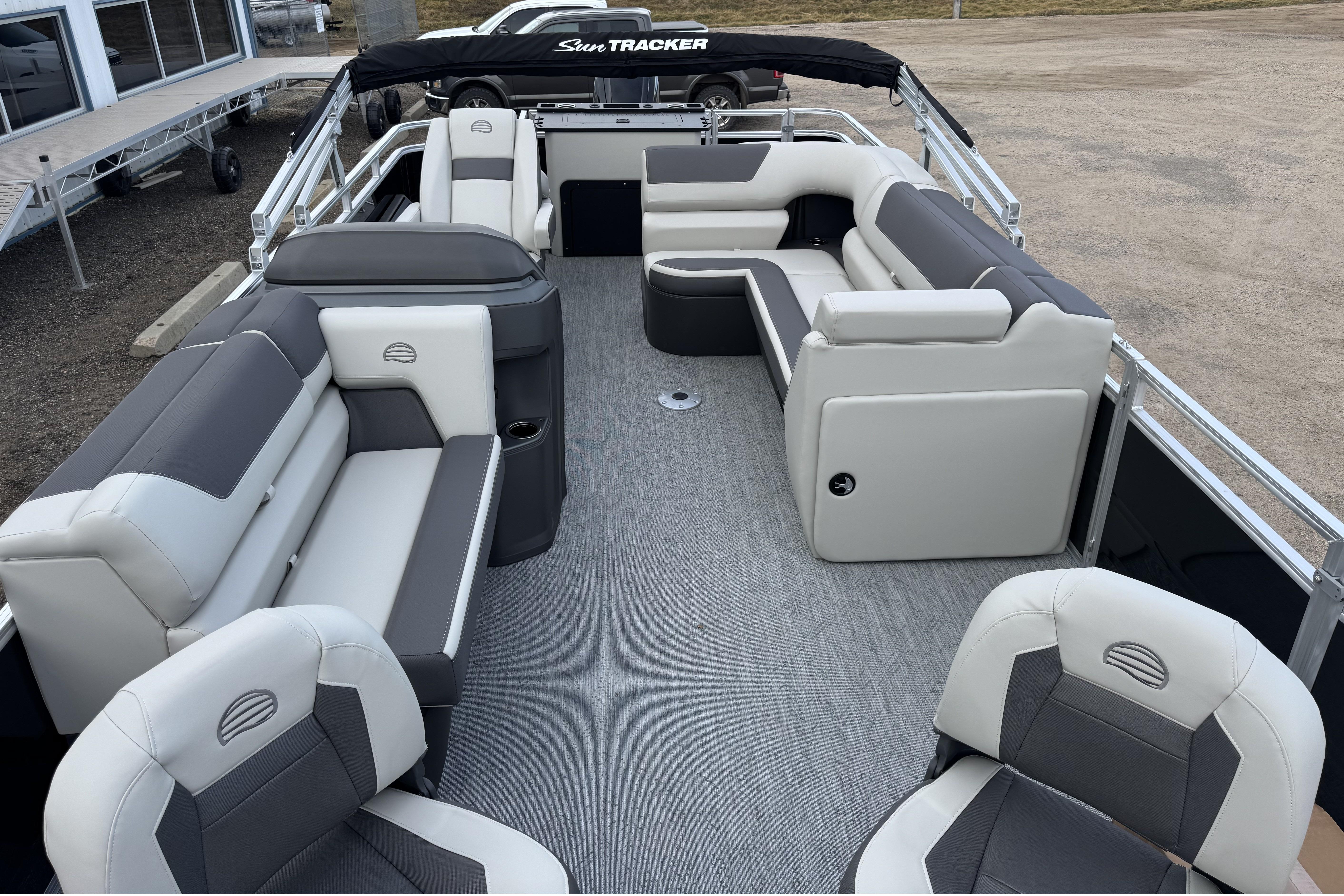 2026 Sun Tracker Fishin' Barge 22 DLX interior with spacious seating and modern design.