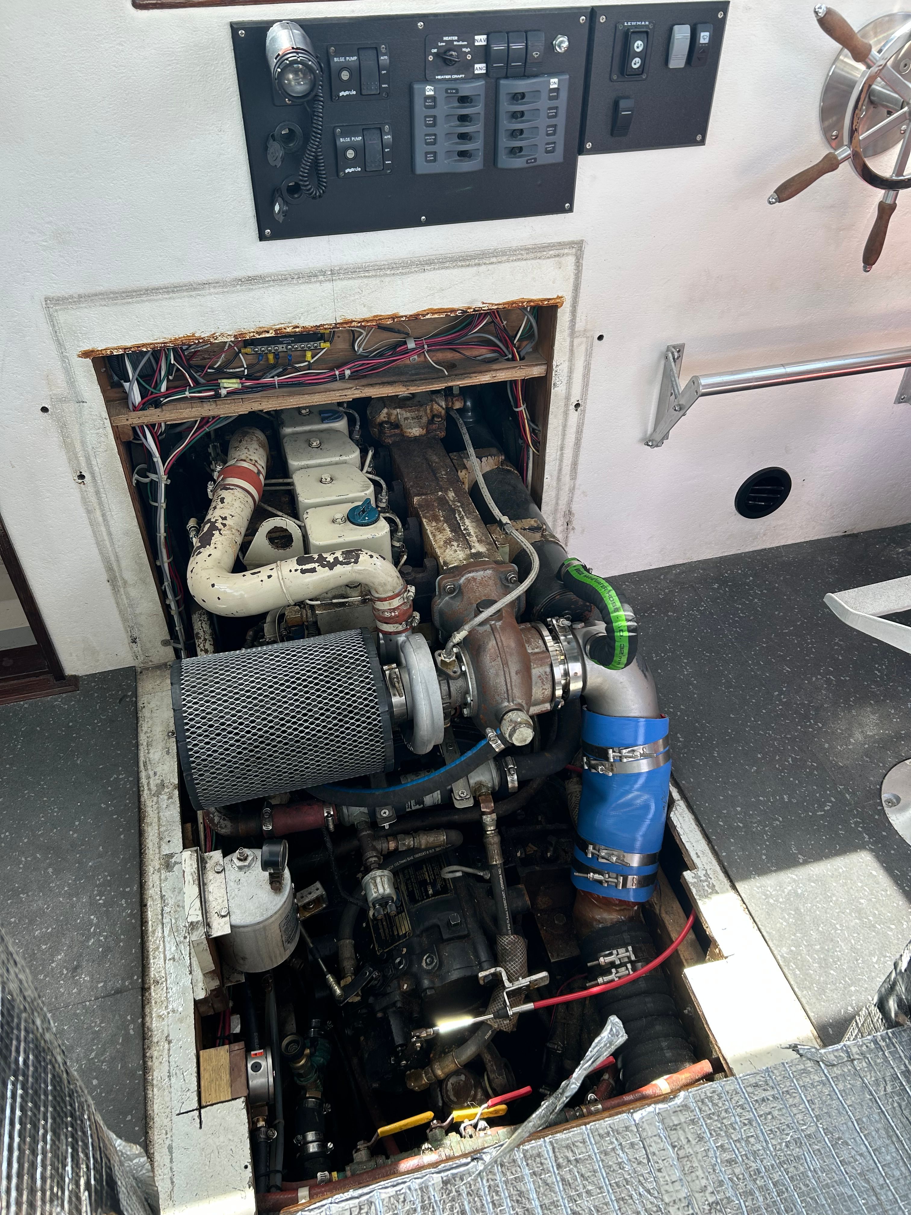 Engine compartment of a 1993 Custom Jim Beal boat with visible engine and control elements.