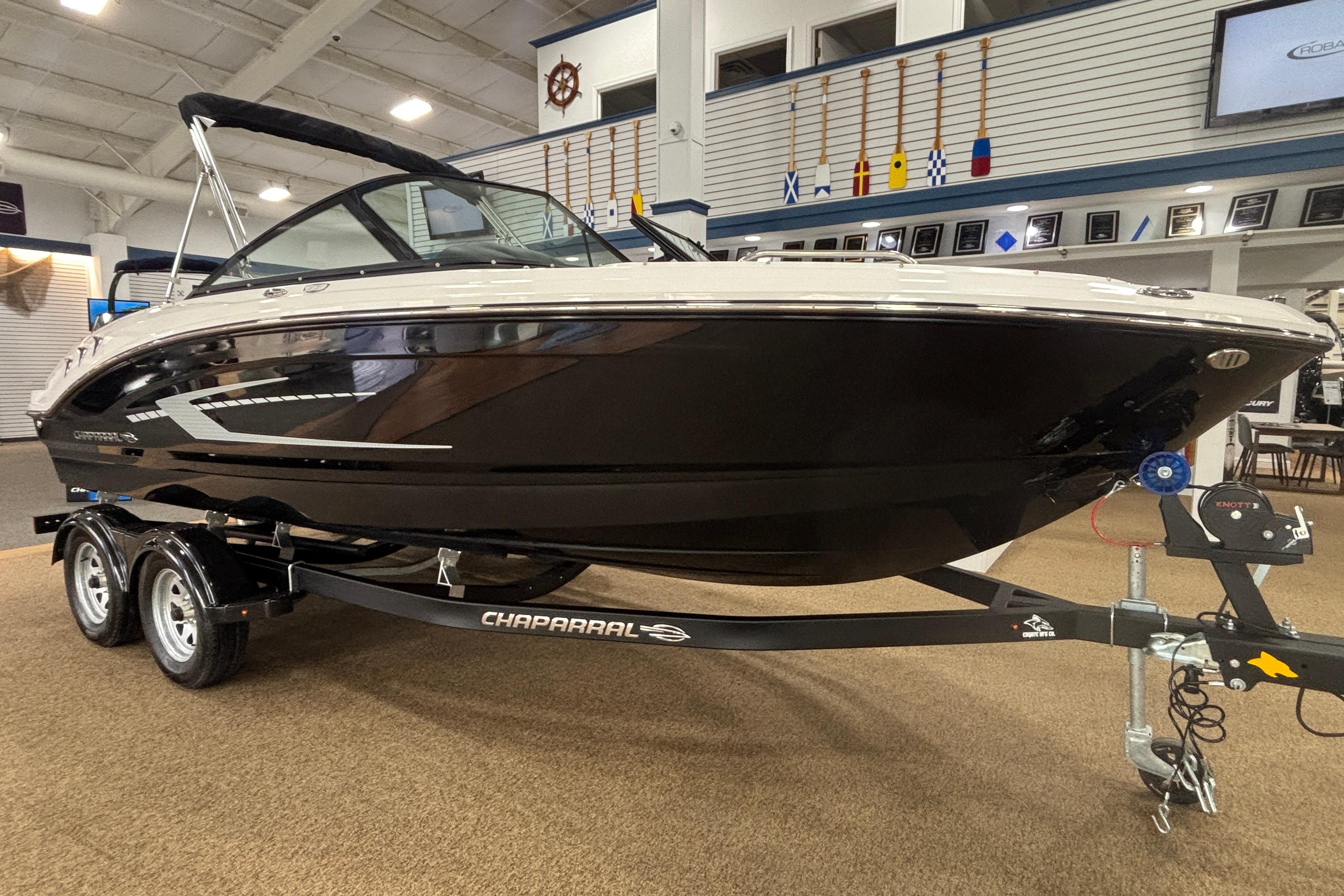 2026 Chaparral 21 SSi boat in showroom on trailer.