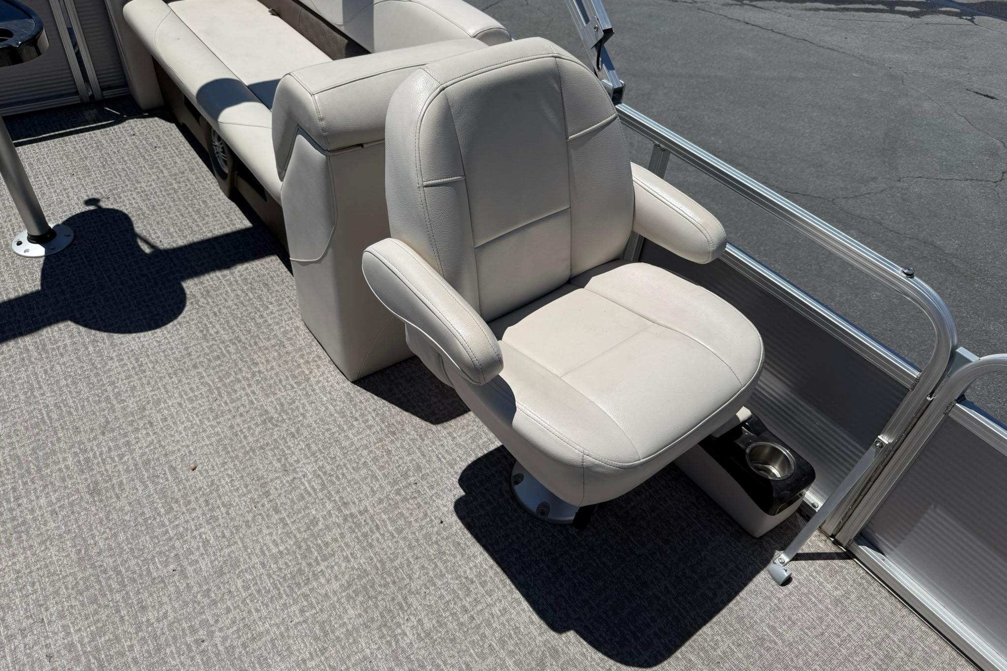 2019 Avalon GS Quad Lounge boat interior with plush seating and cup holder.