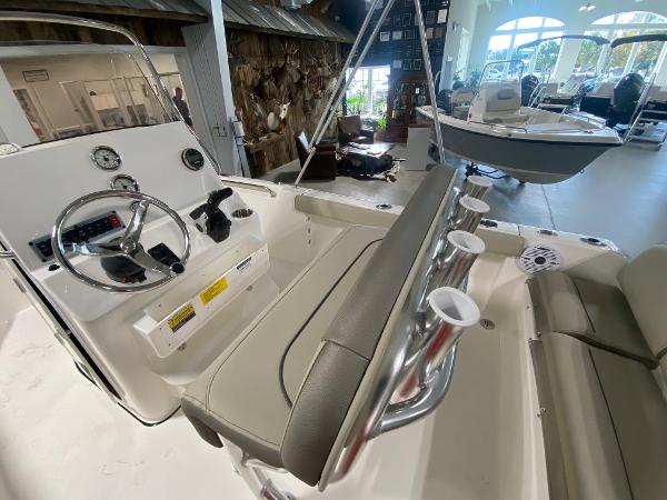 2024 Key West 189 FS boat interior with steering console and seating.