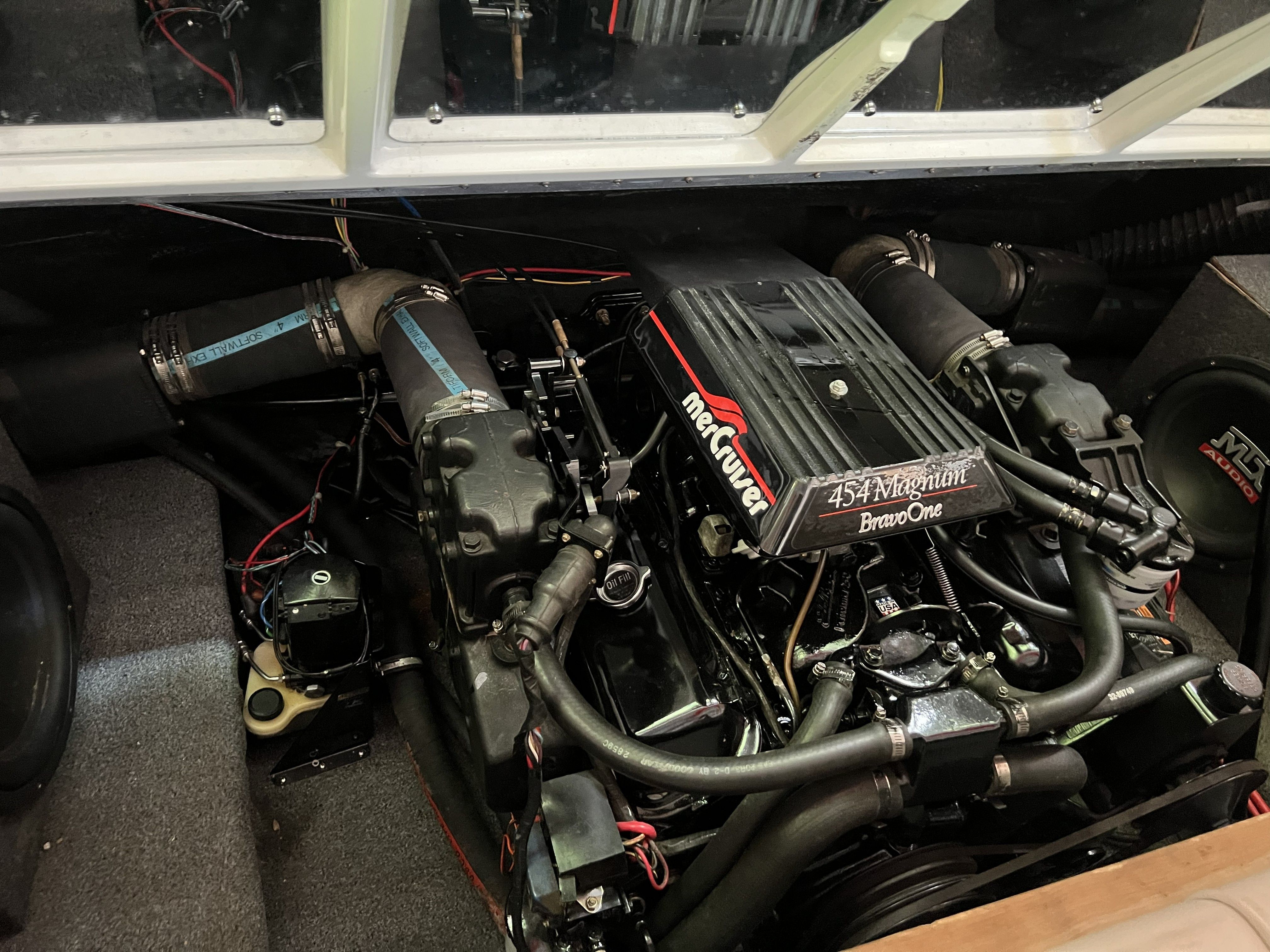 Engine compartment of a Rinker 236 Sport Cuddy featuring a MerCruiser engine.