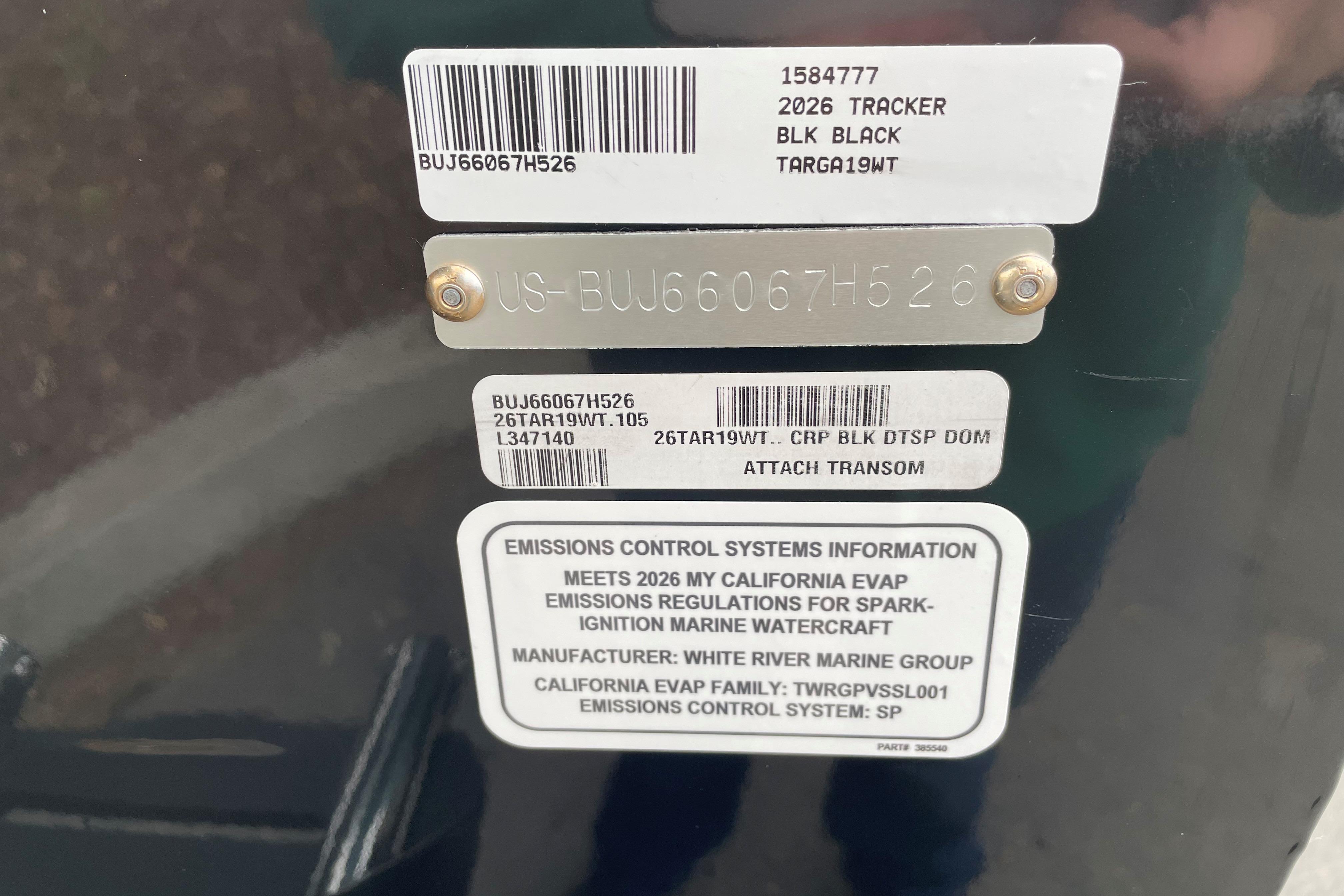 2026 Tracker Targa V-19 WT emissions control label and serial number plate.