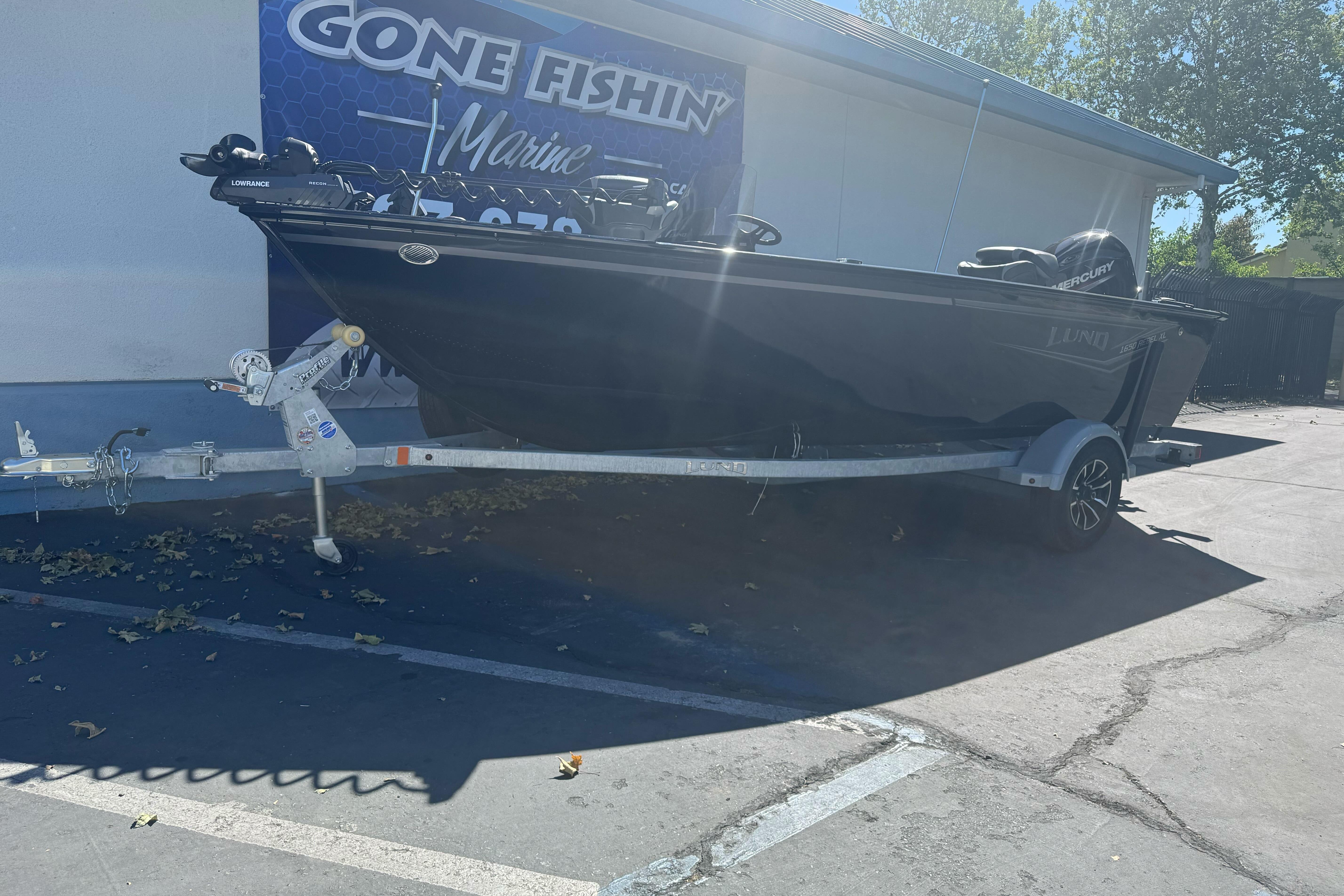 2026 Lund 1650 Rebel XL SS boat on trailer at Gone Fishin' Marine dealership.