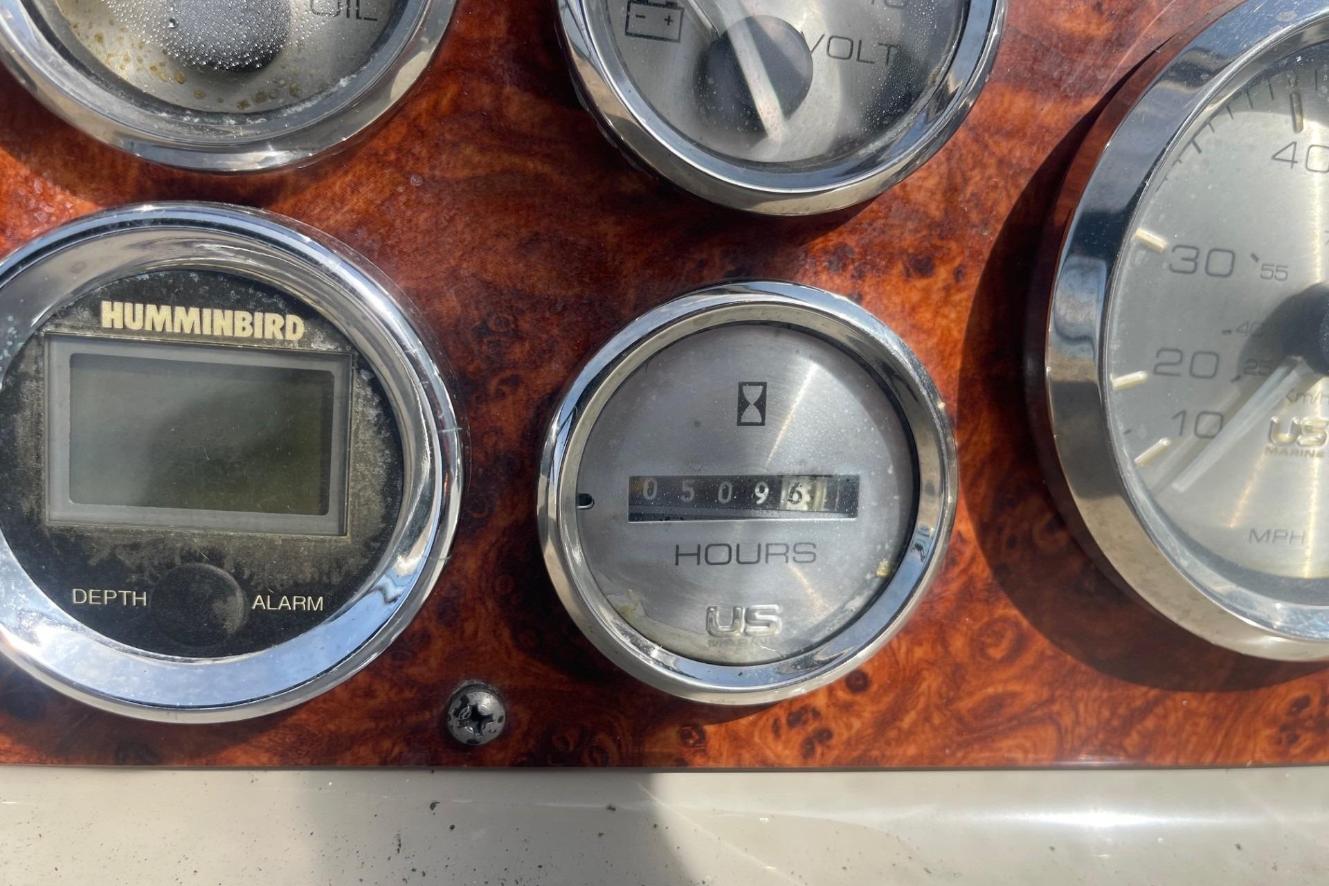 Instrument panel of a 1997 Bayliner 2655 Ciera boat showing gauges and displays.