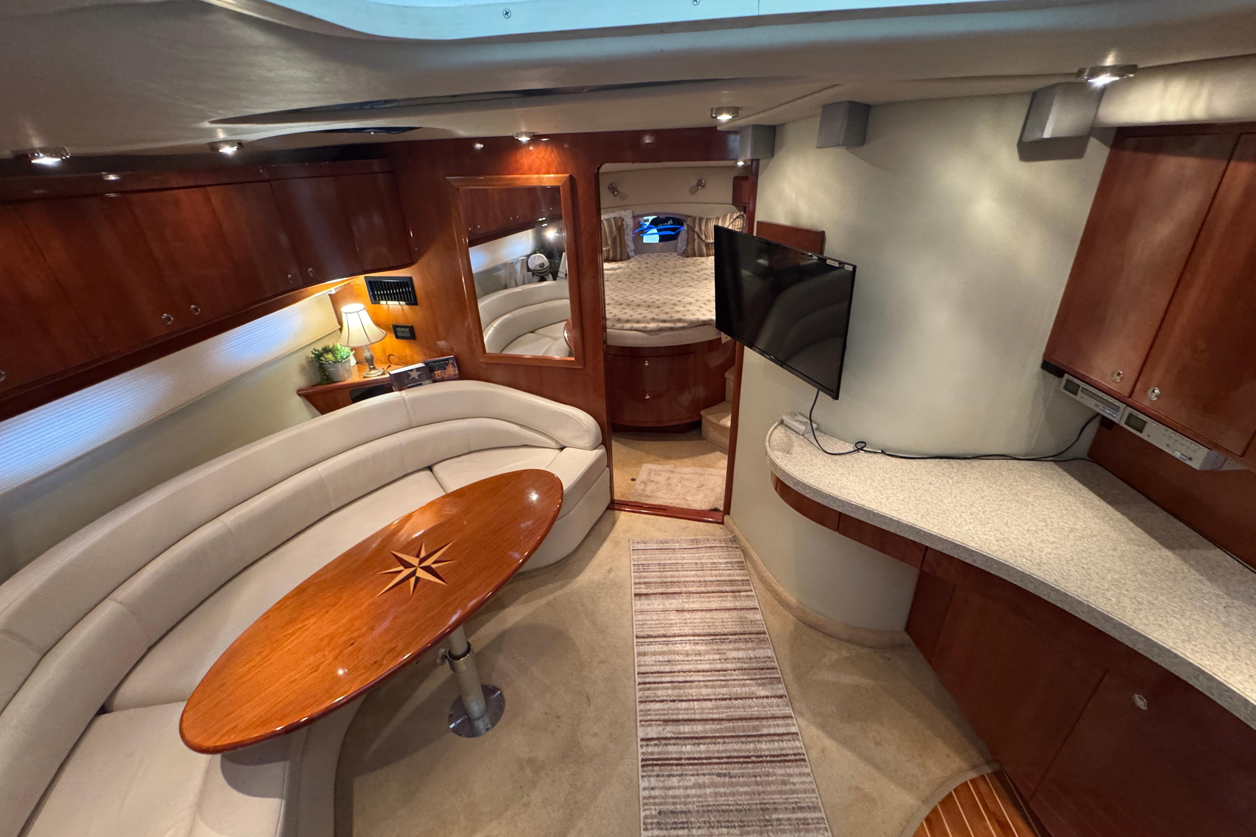Luxurious interior of 2005 Regal Commodore 4260 yacht with elegant seating and modern amenities.