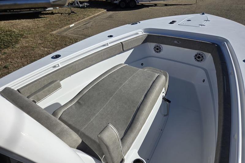 2026 Sea Hunt Ultra 275 Coffin Box boat interior with cushioned seating and speakers.