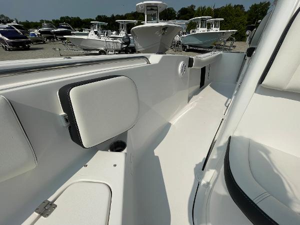 2025 Tidewater 232 CC Adventure boat interior, showcasing sleek white seating and modern design.