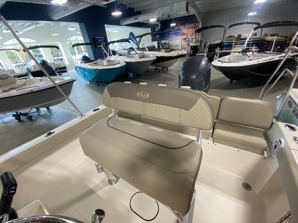 2024 Key West 189 FS boat interior at a showroom with other boats.