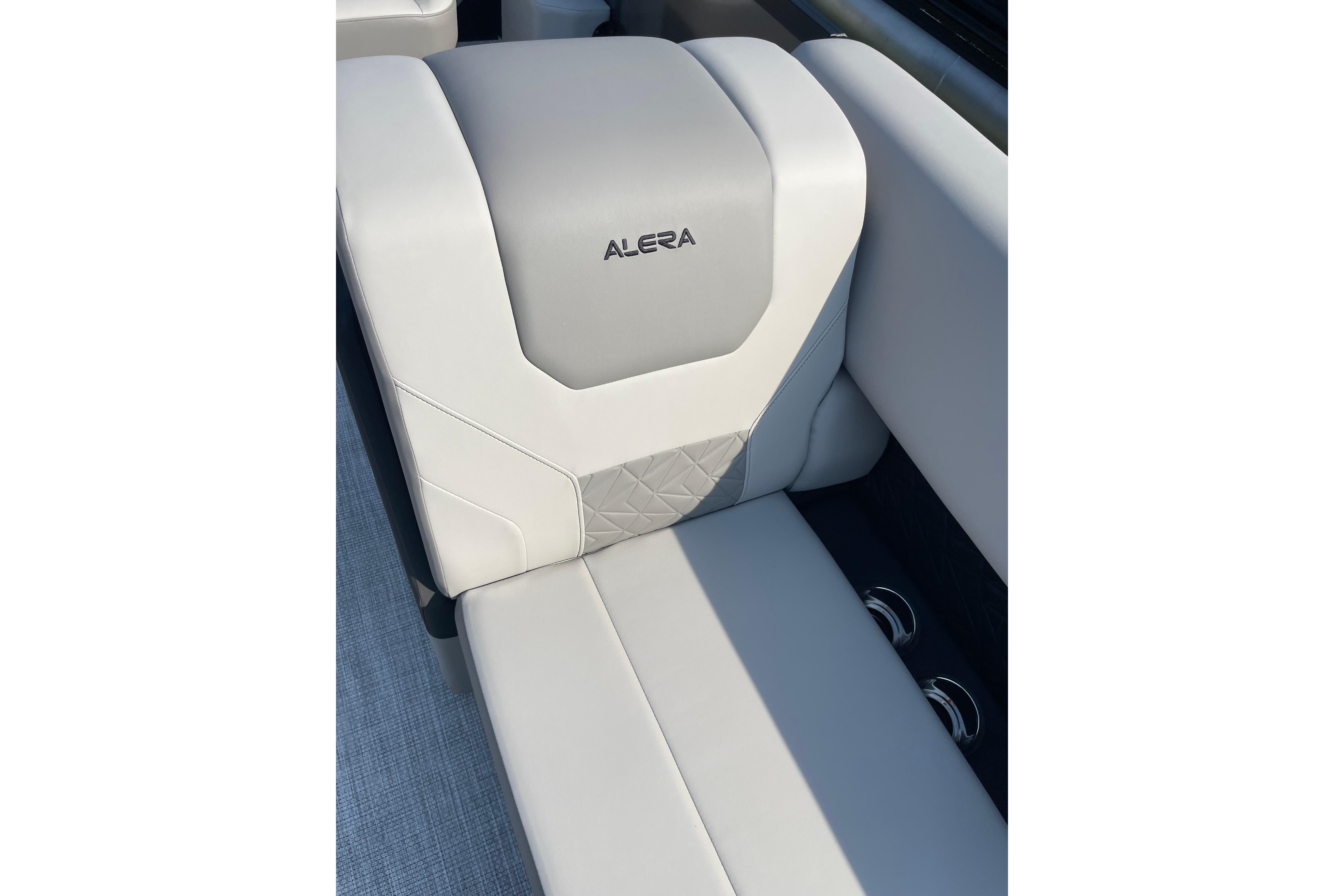 Luxurious Alera a24 2027 boat seat with elegant gray and white upholstery.