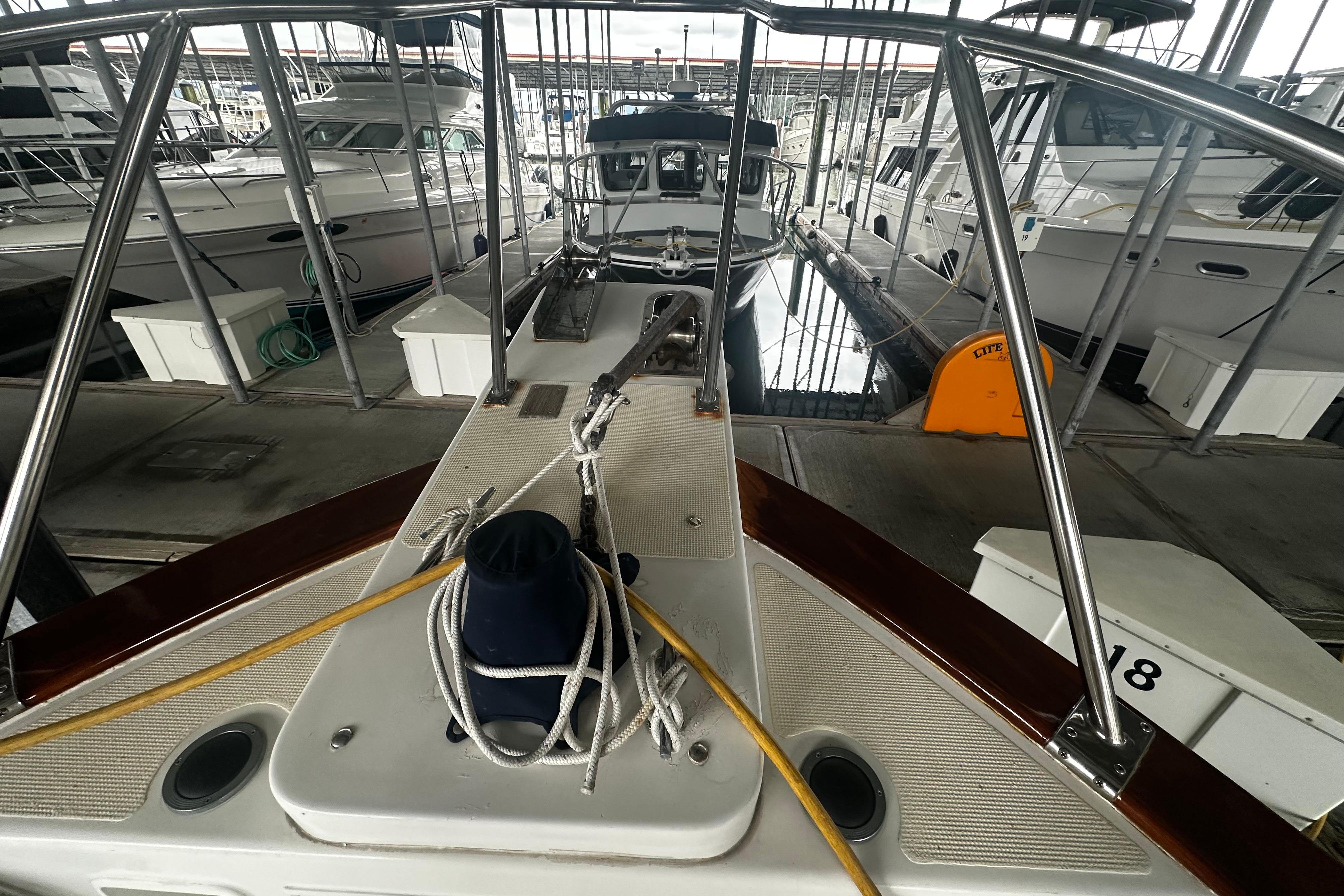 Bow view of 2000 Island Gypsy 36 yacht docked in marina.