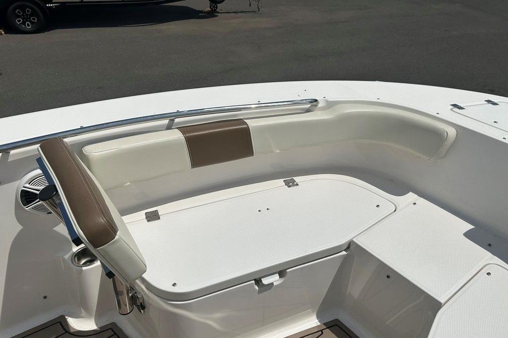 2017 Robalo R200ES boat interior with cushioned seating and storage compartment.