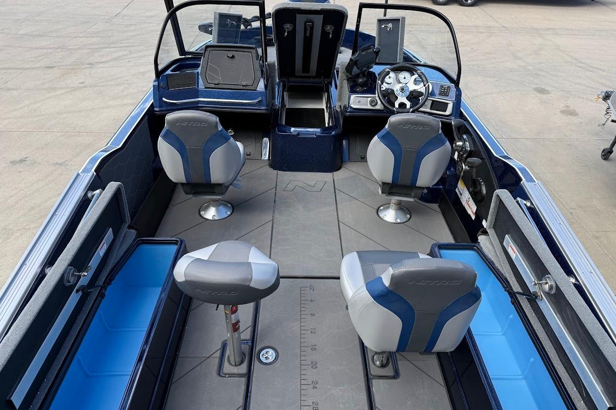 Interior of a 2026 Nitro ZV21 Pro boat with seating and steering console.
