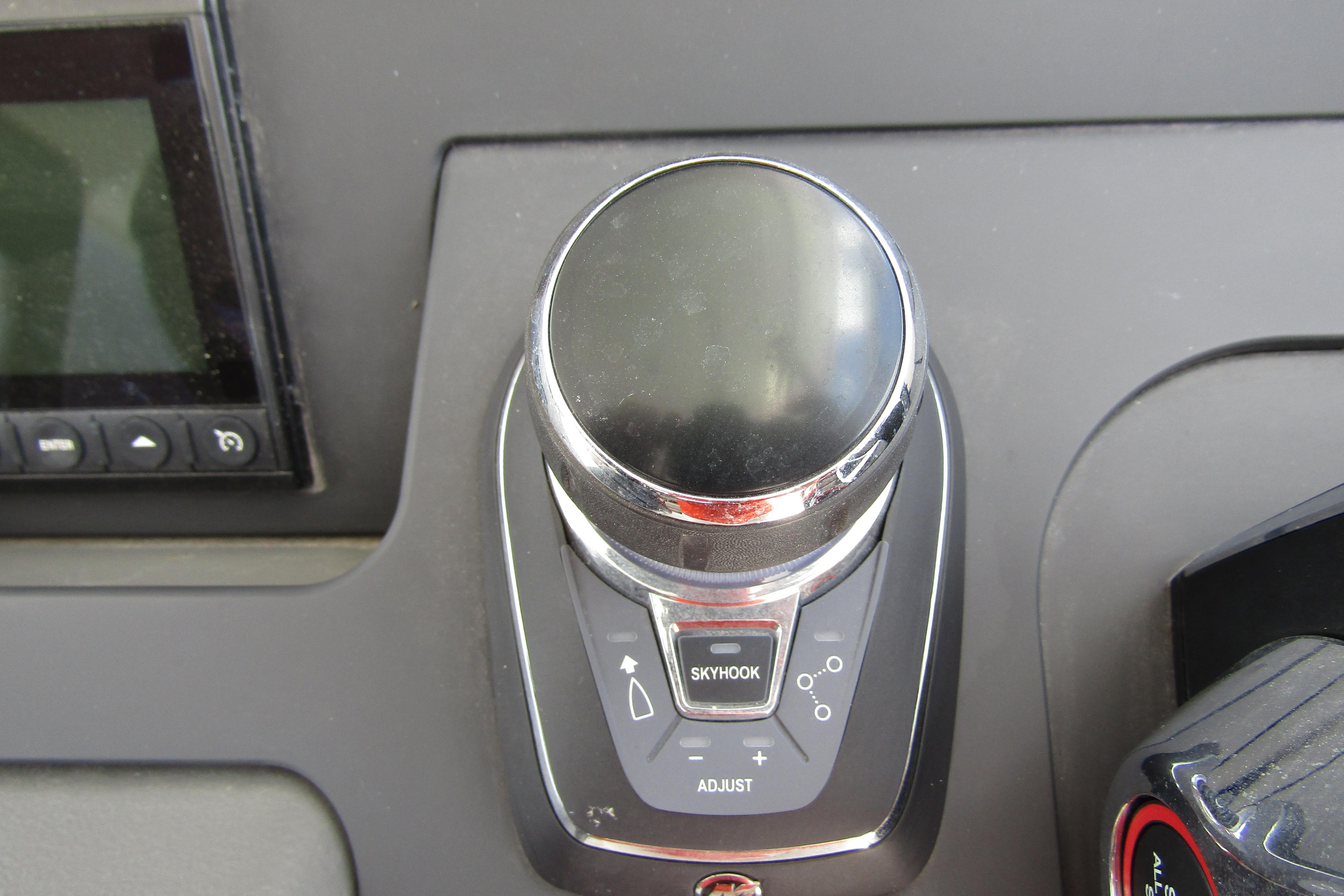 Control panel of 2025 Nimbus Tender 11 boat featuring joystick and Skyhook button.