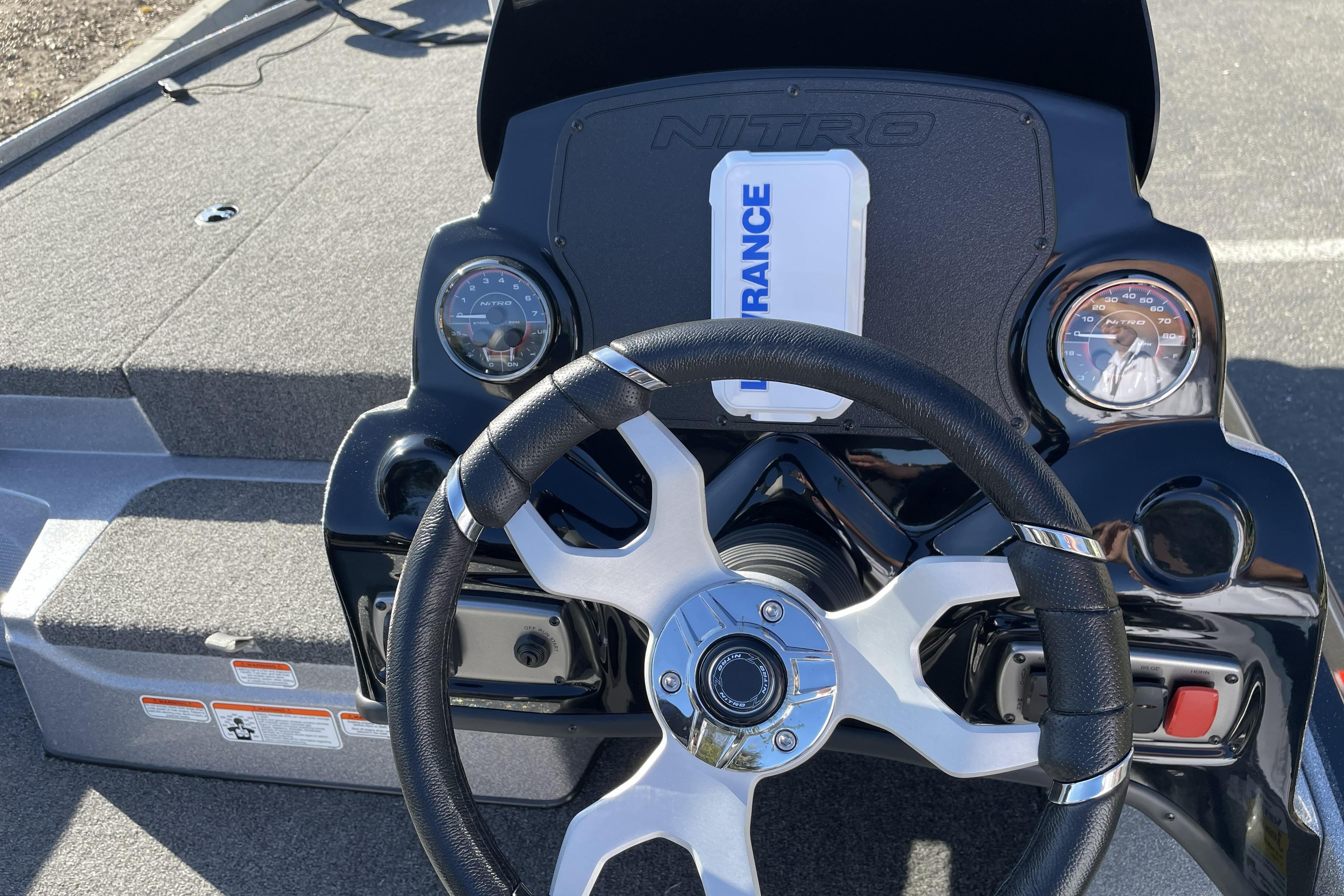 Steering console of 2026 Nitro Z17 boat with gauges and Lowrance device.