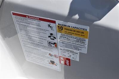 Safety and capacity labels on 2026 Lowe SF 212 Sport Fish boat.