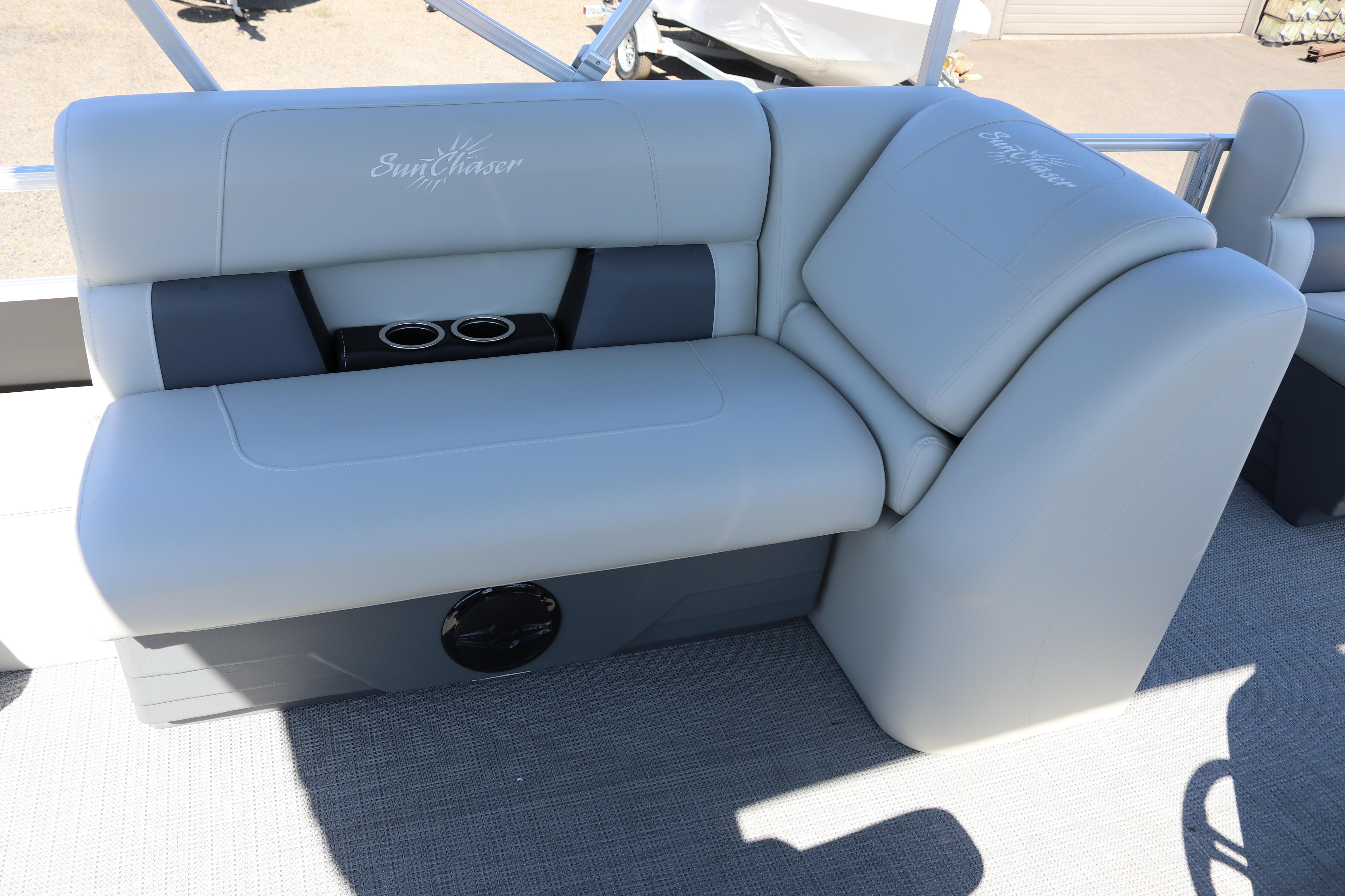 2025 SunChaser Vista 20 Fish boat seating with cup holders, featuring light gray upholstery.