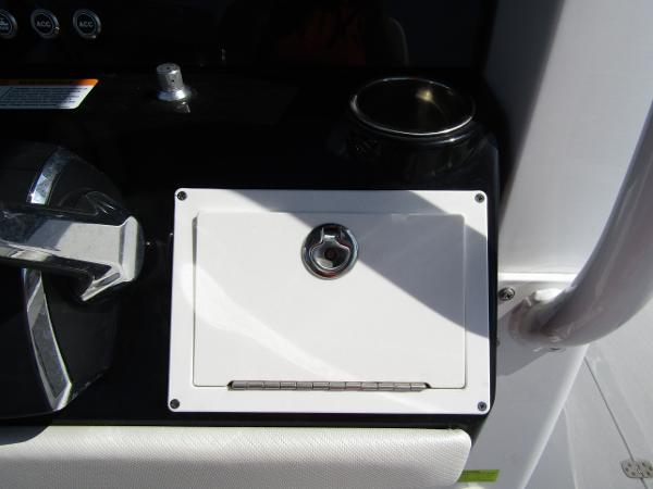 2024 Wellcraft 263 Fisherman console with control lever and storage compartment.