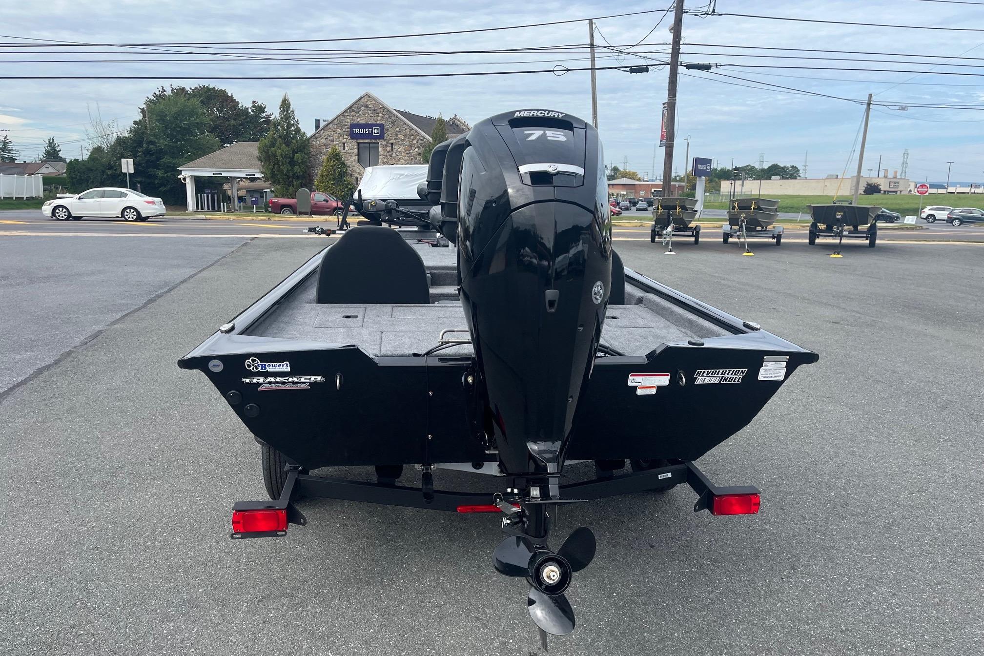 2026 Tracker Pro Team 175 boat with Mercury 75 engine, parked outdoors.