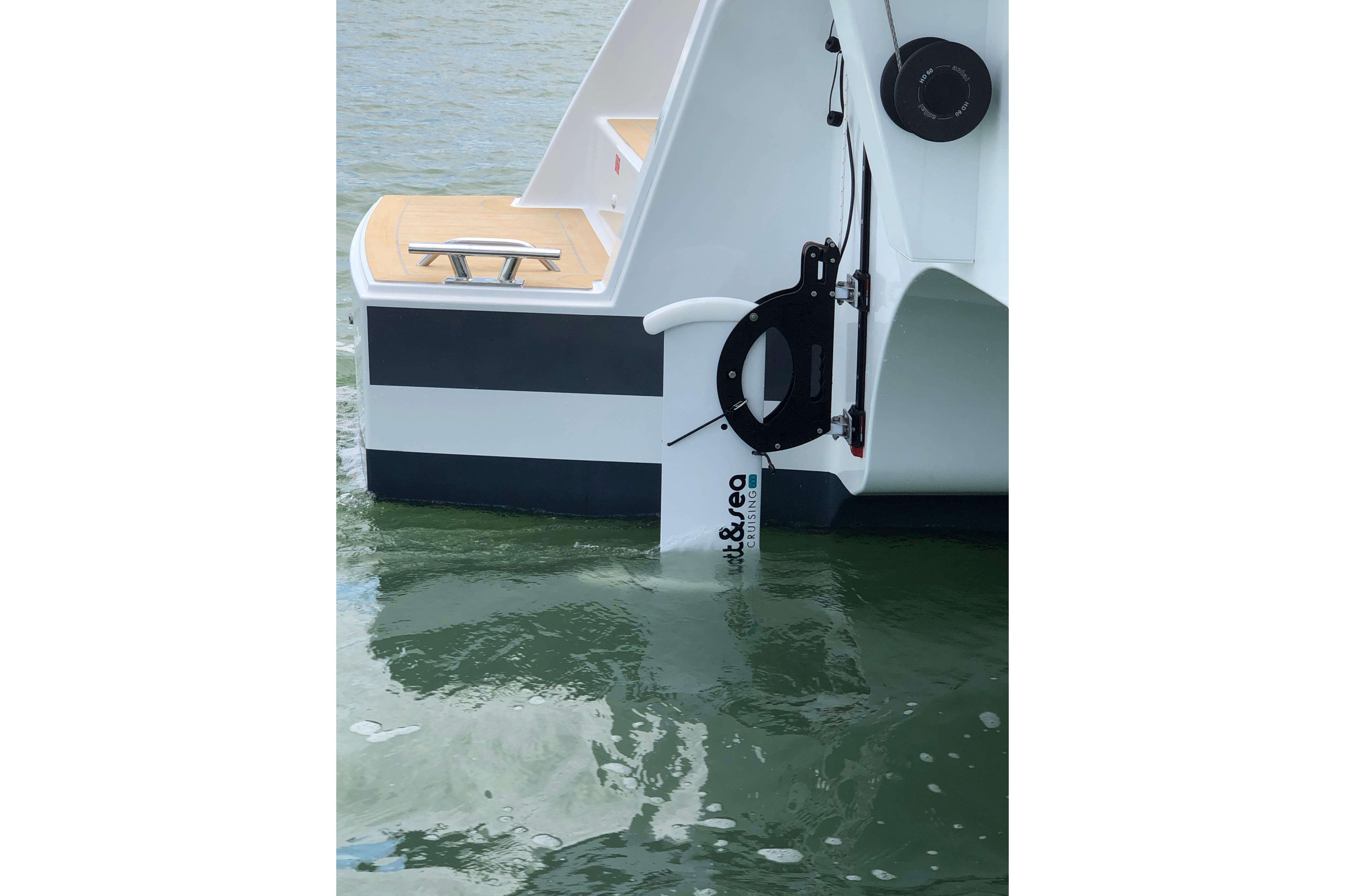 2020 Fountaine Pajot Saona 47 catamaran stern view with water reflection.