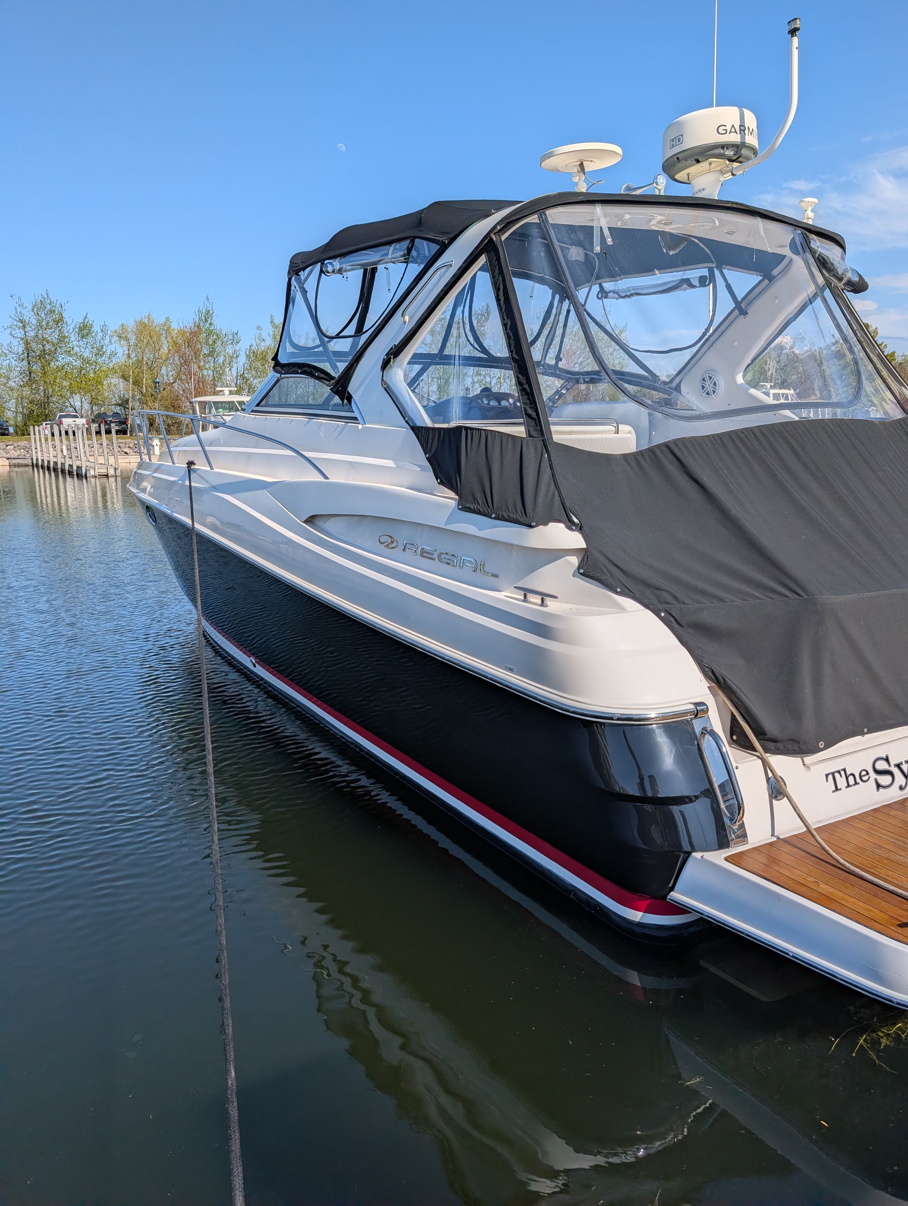 2005 Regal Commodore 3560 boat on water, side view.