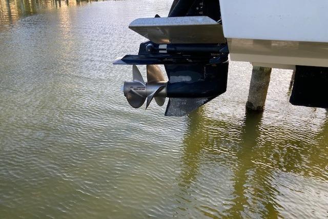 Propeller of 2006 Sea Ray 270 Sundeck boat above water surface.