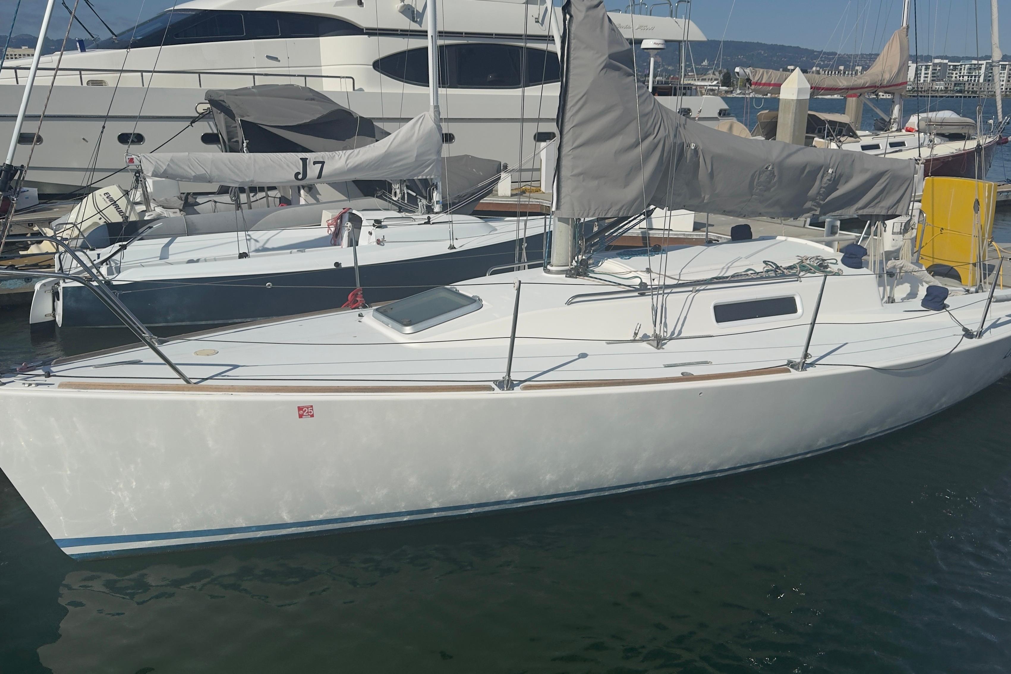 Sailboat J/92 by J Boats, 1994 model, docked in a marina.