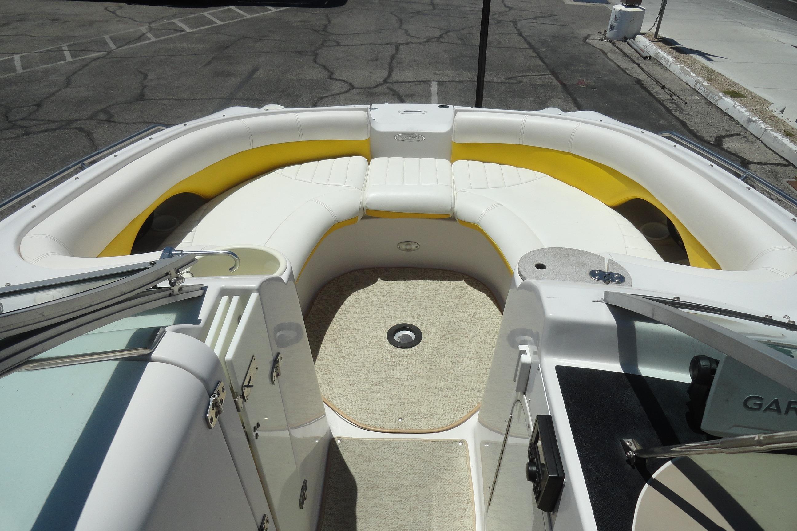 2005 Four Winns 214 Funship boat interior with white and yellow seating.