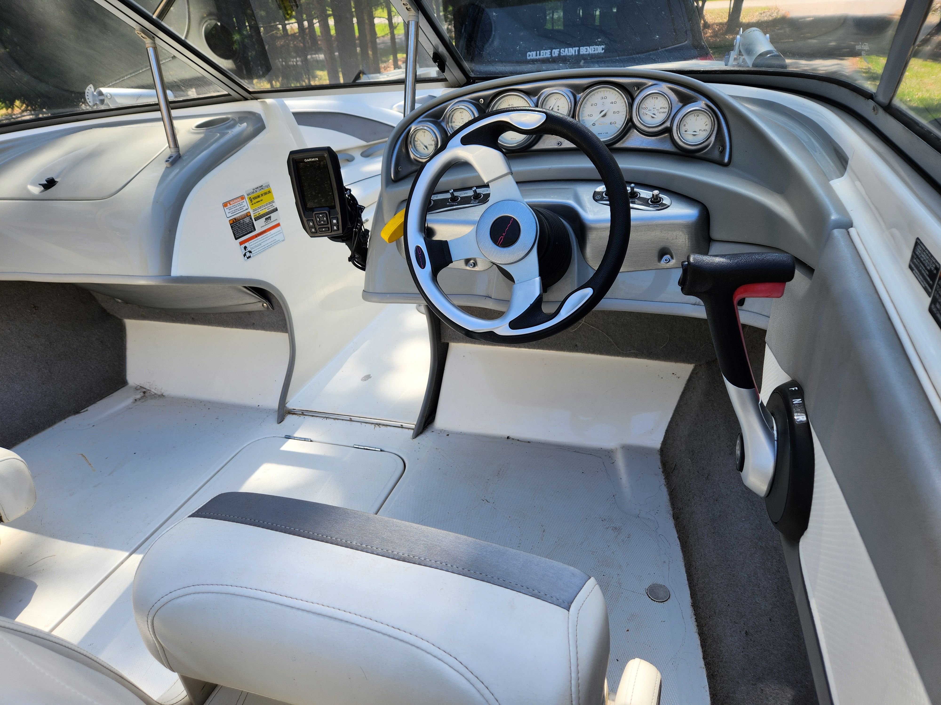 Interior of a 2009 Bayliner 194SF with steering wheel and dashboard.