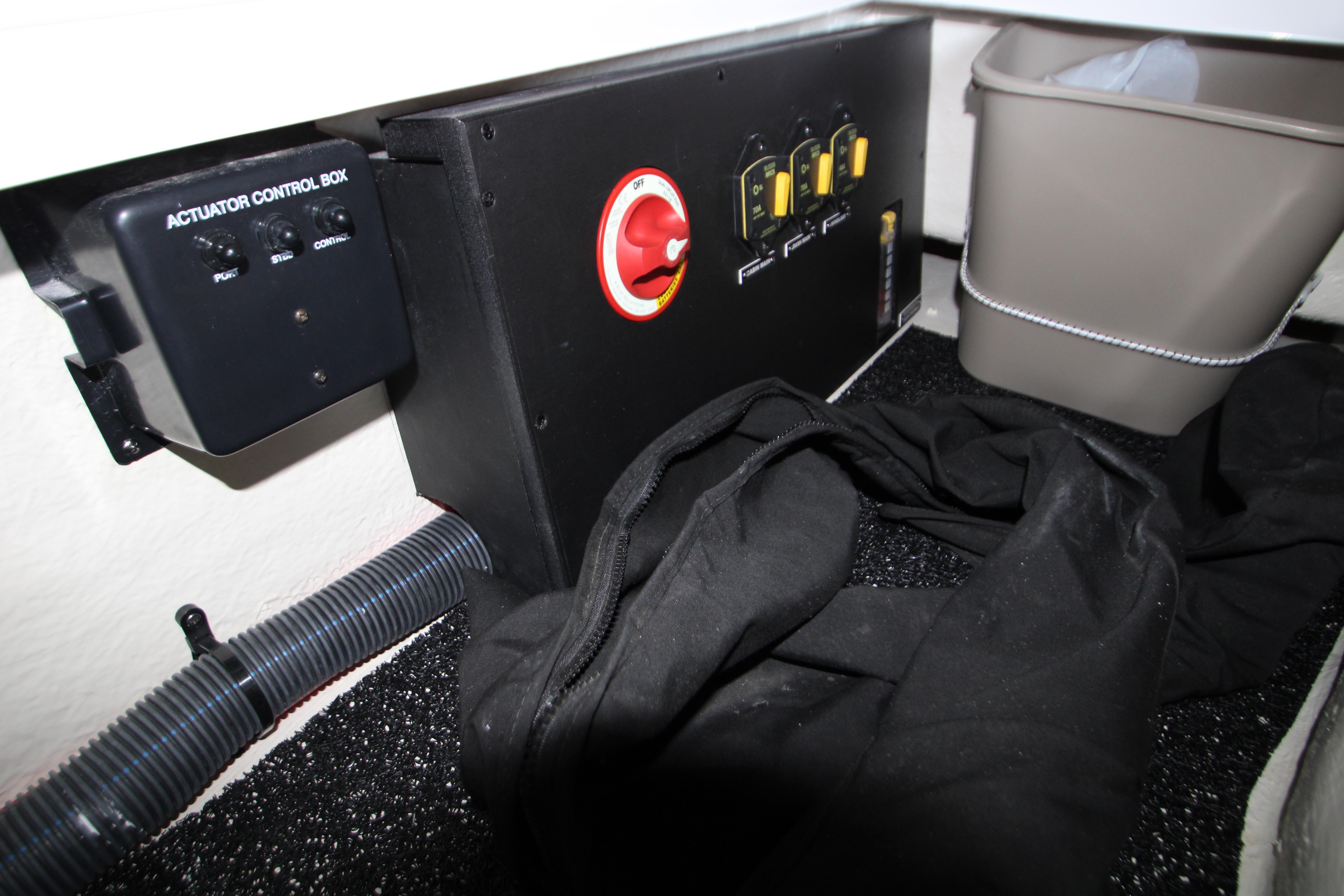 2022 Regal 28 Express boat interior with control box and storage area.