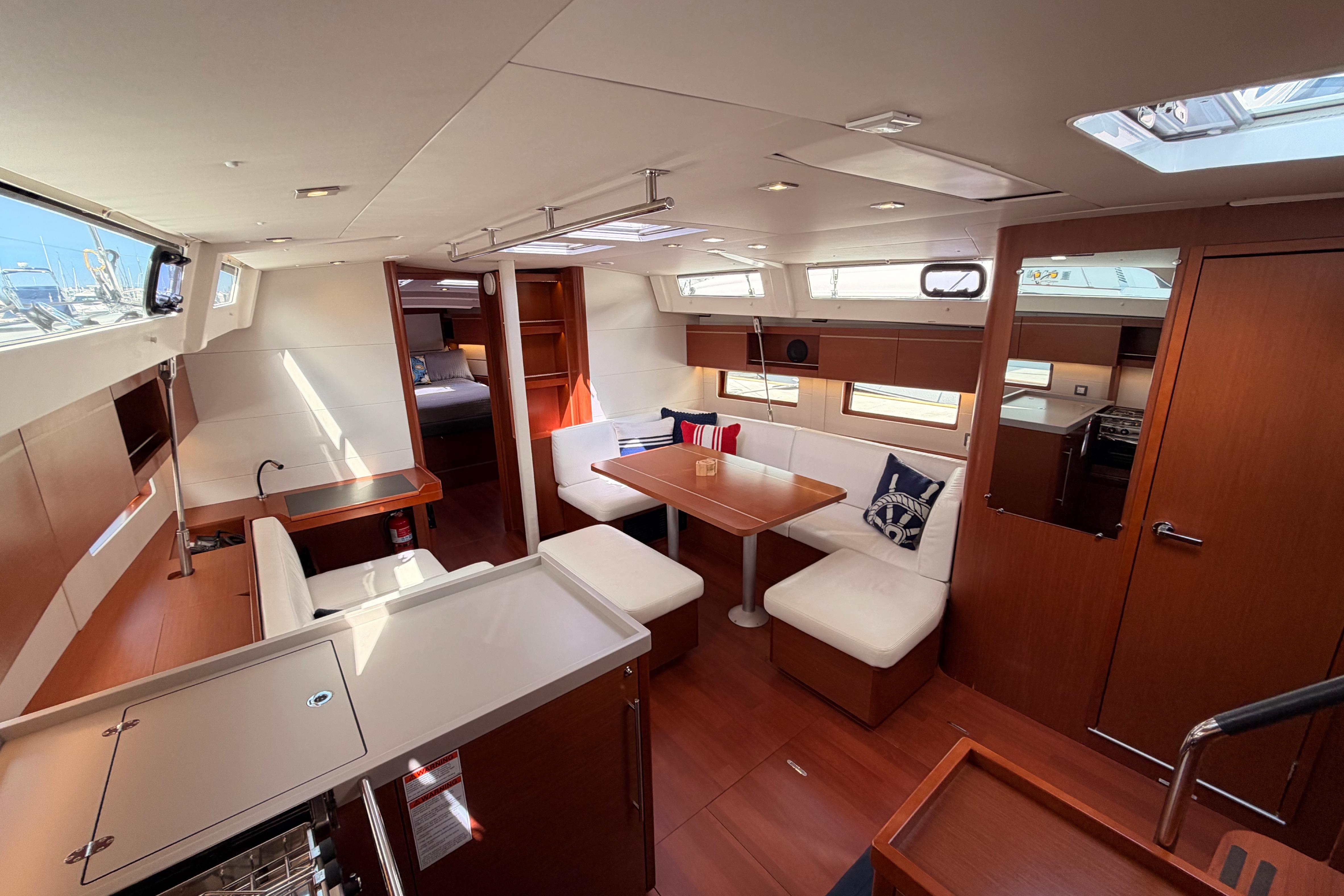 Interior of 2020 Beneteau Oceanis 46.1 yacht, featuring modern seating and dining area.