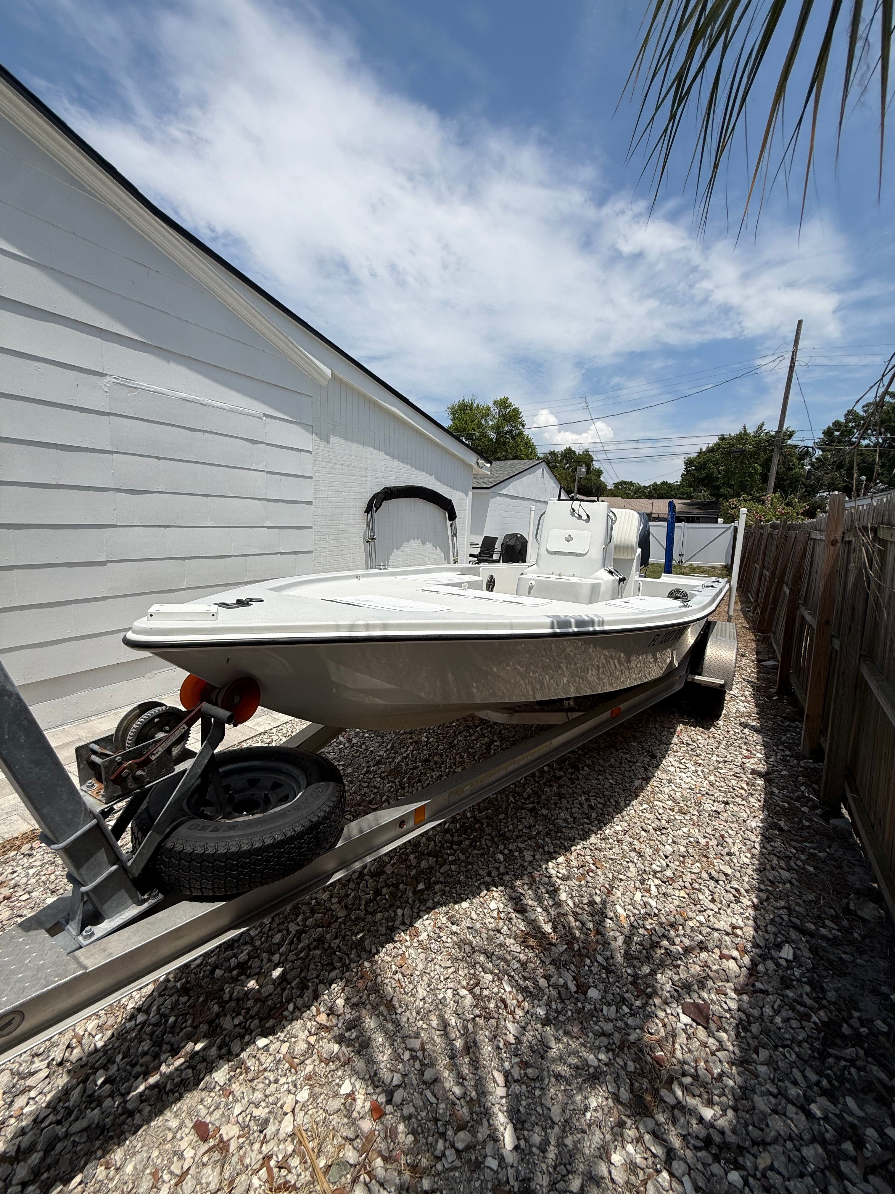 2012 Bay Craft 21 boat on trailer outdoors.