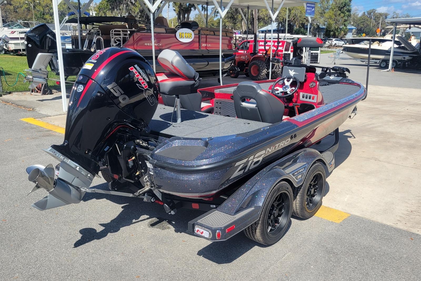 2026 Nitro Z18 boat with powerful engine, sleek design, and dual-axle trailer.