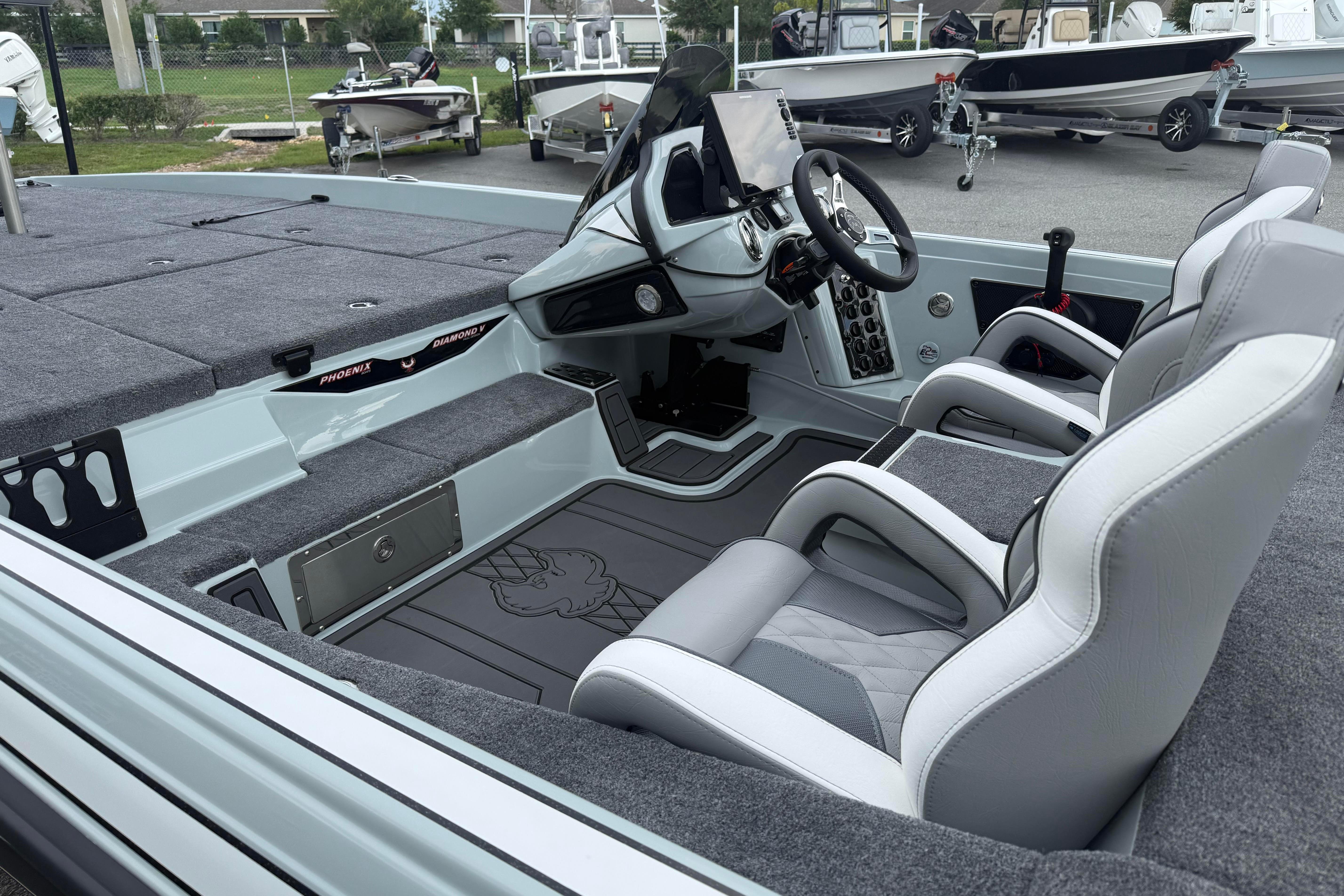 2027 Phoenix 921 Elite X II boat interior with modern seating and control panel.