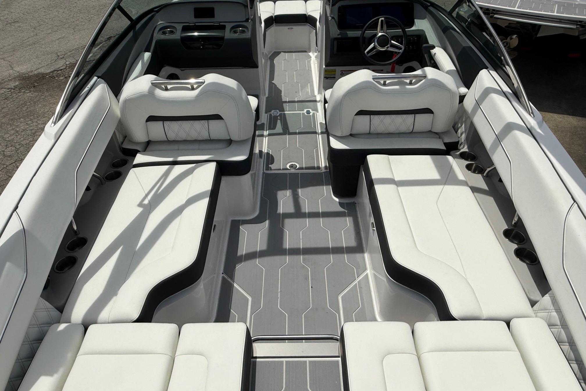 2026 Regal LS4 Surf boat interior with luxurious white seating and modern dashboard.