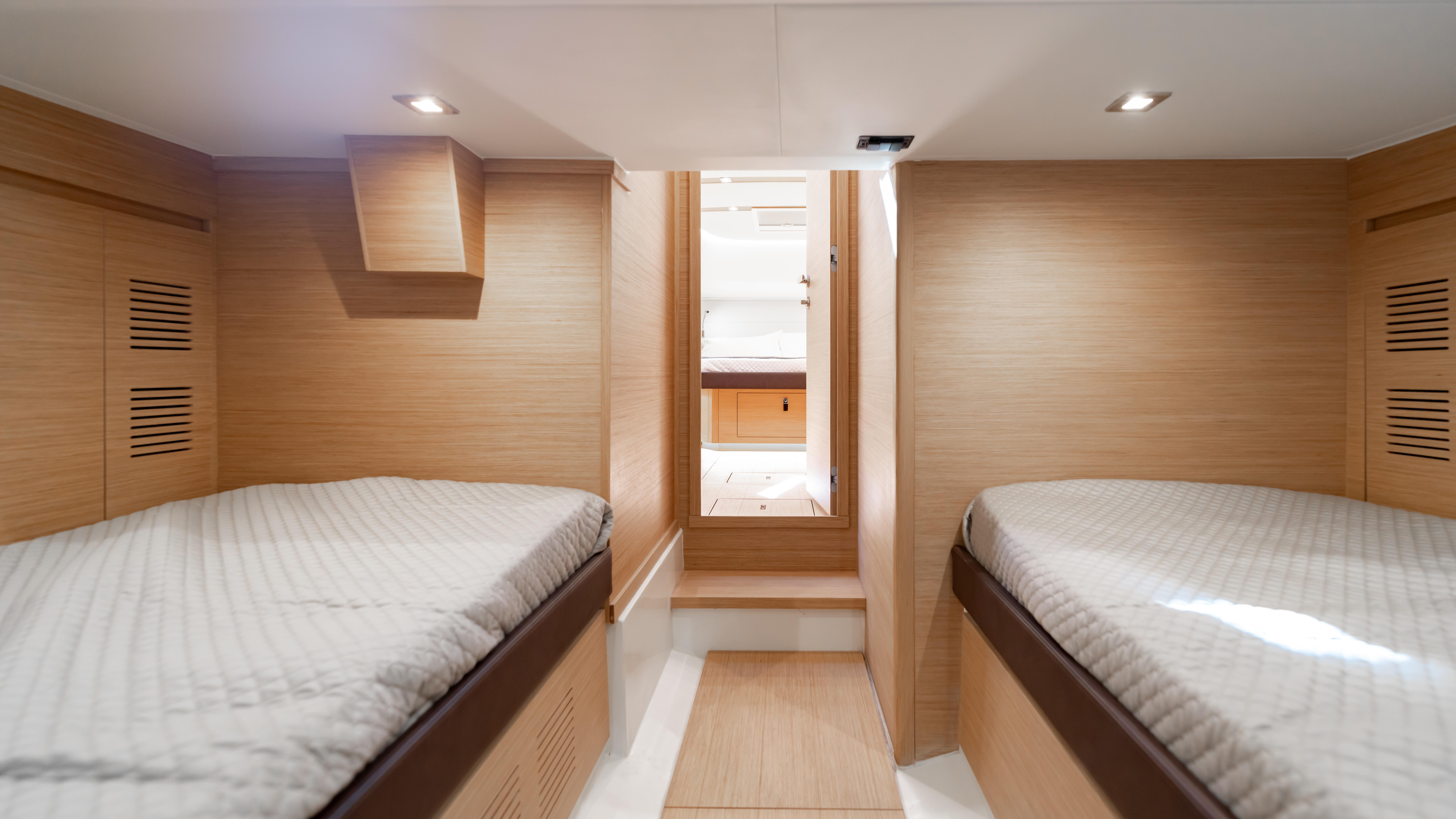 2024 Pardo Yachts 43 interior cabin with twin beds and modern wood finish.