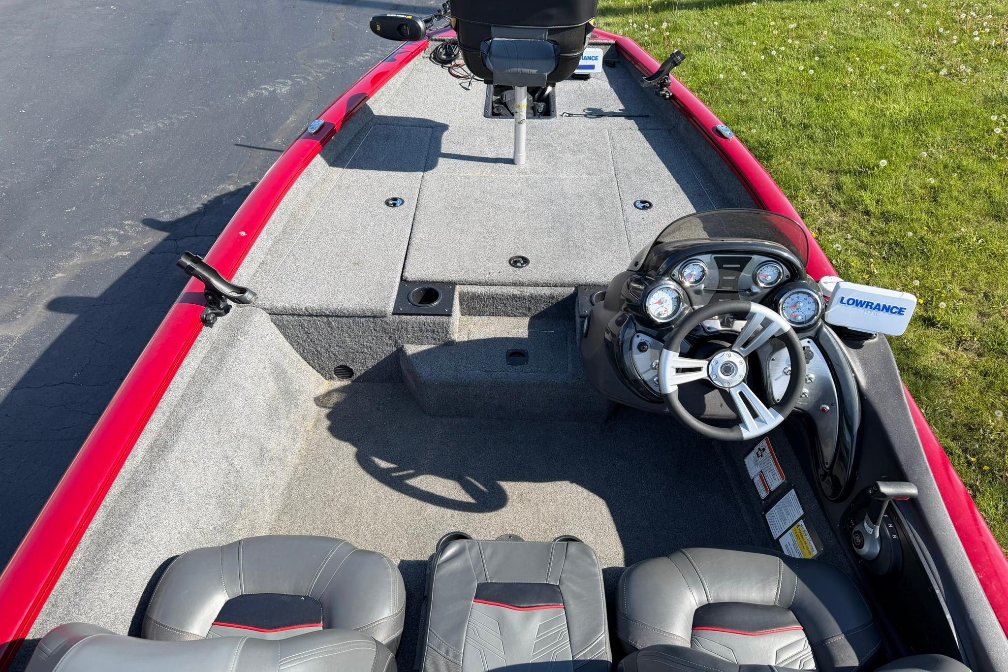 2024 Tracker Pro Team 175 TXW boat interior with steering console and seating.