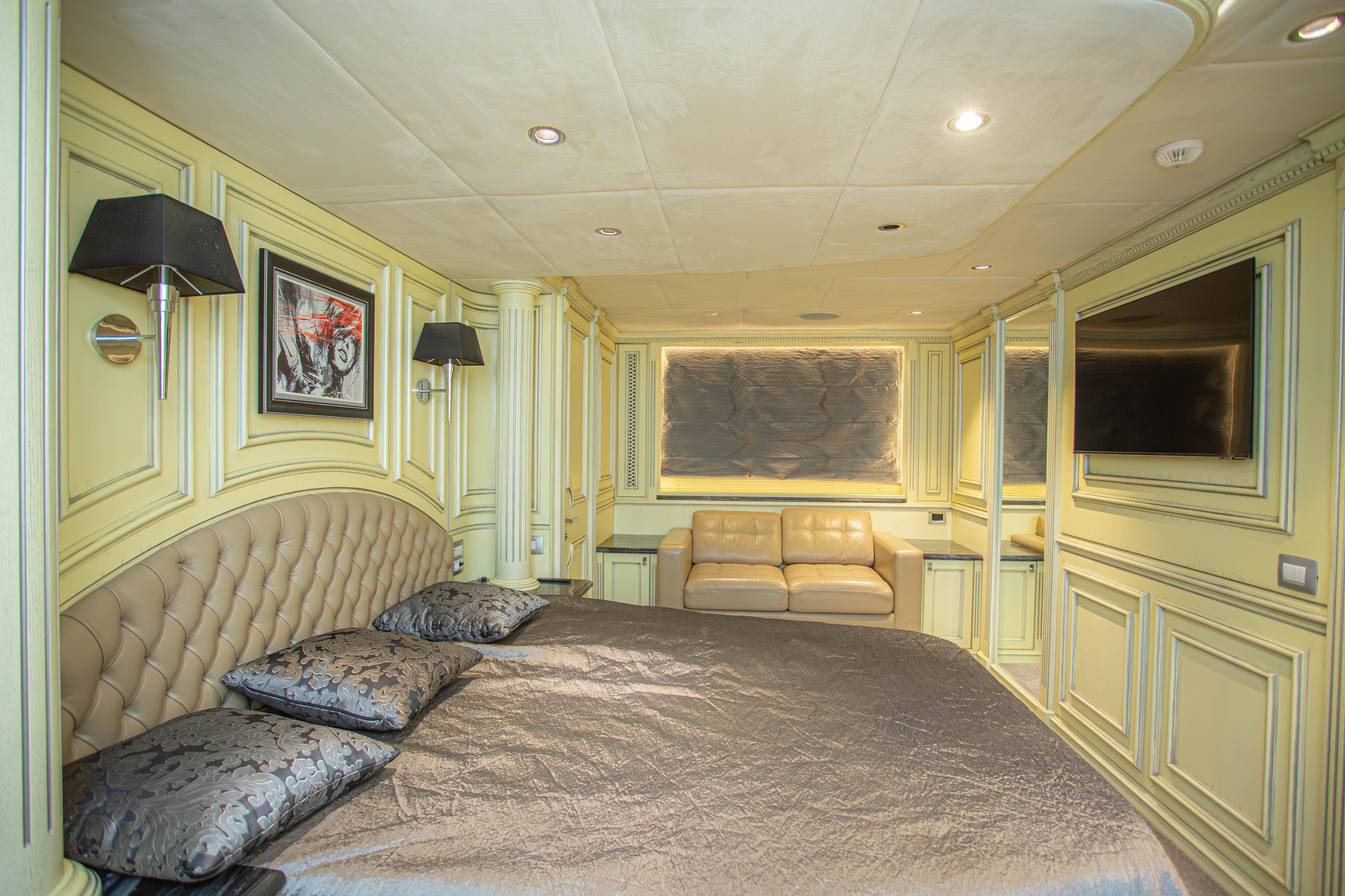 Luxurious bedroom interior of 2014 Fifth Ocean Yachts 24m Displacement Explorer Yacht.