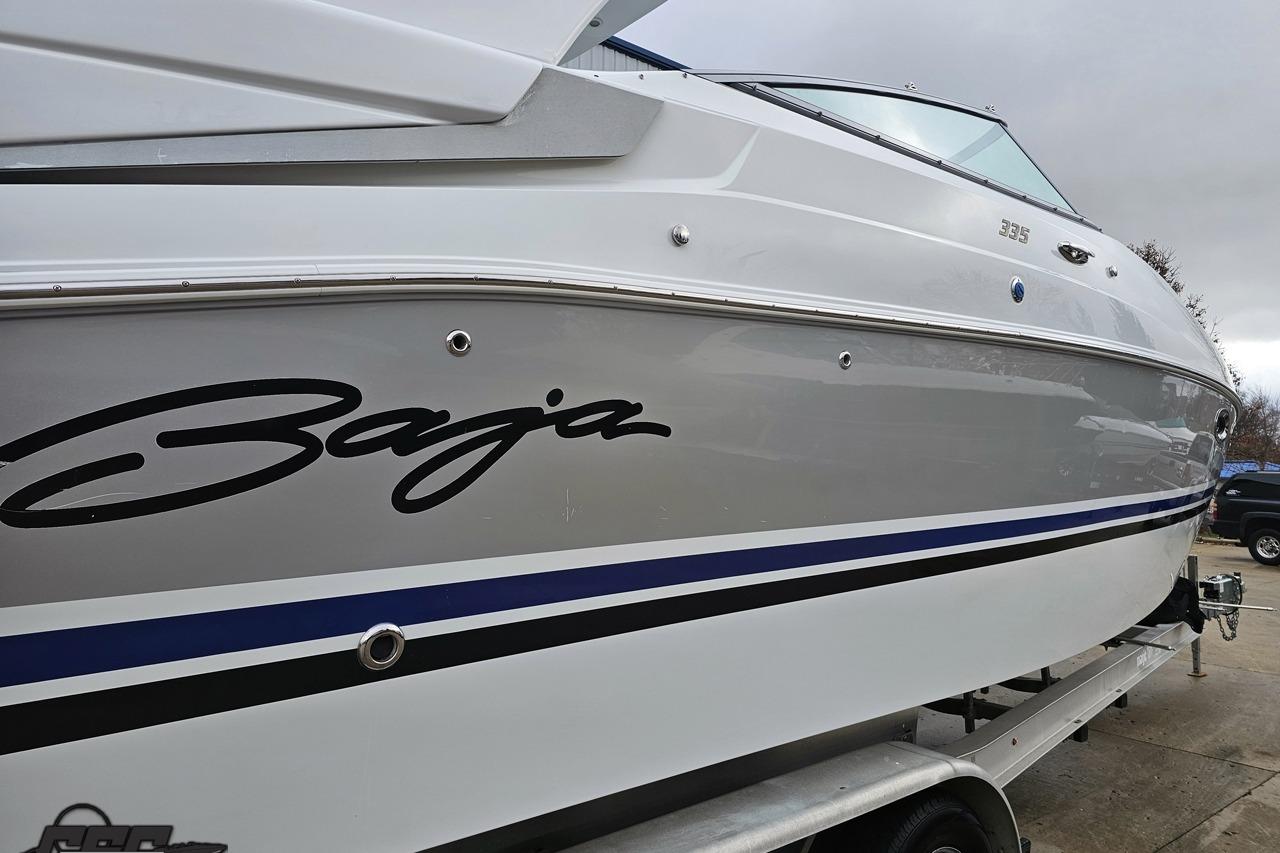 2008 Baja 335 Performance boat on trailer, showcasing sleek design and branding.