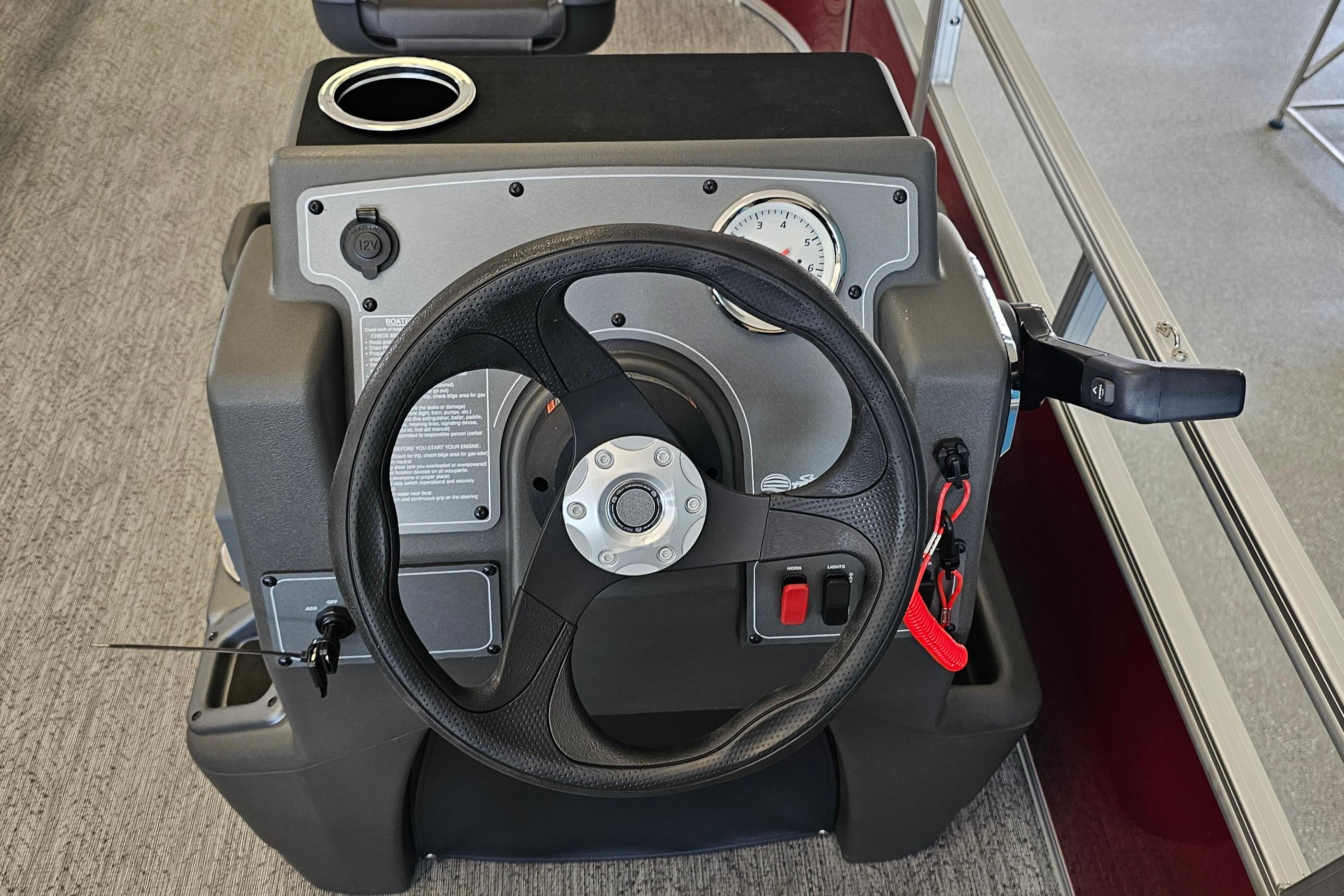 Steering console of 2026 Sun Tracker Bass Buggy 16 XL Select pontoon boat.