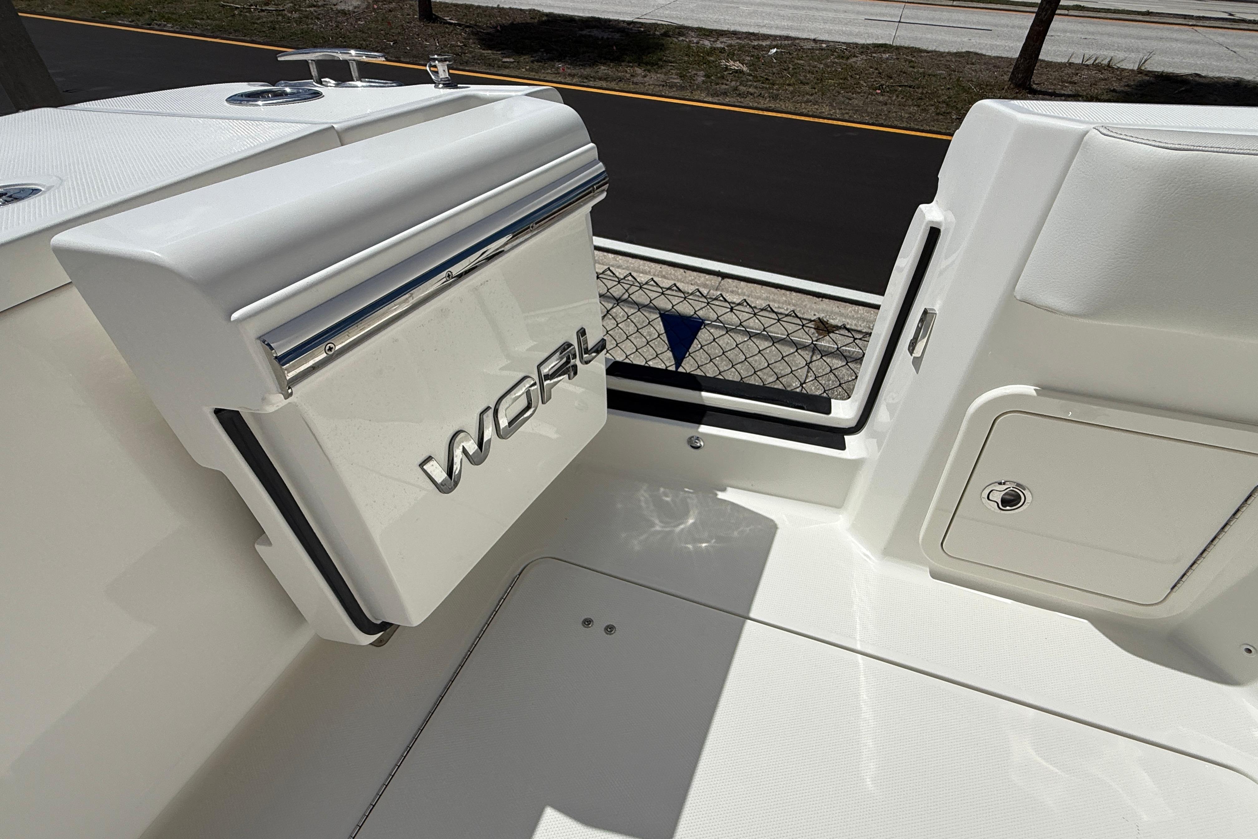 2026 World Cat 400 DC-X Island boat interior detail with storage compartment.