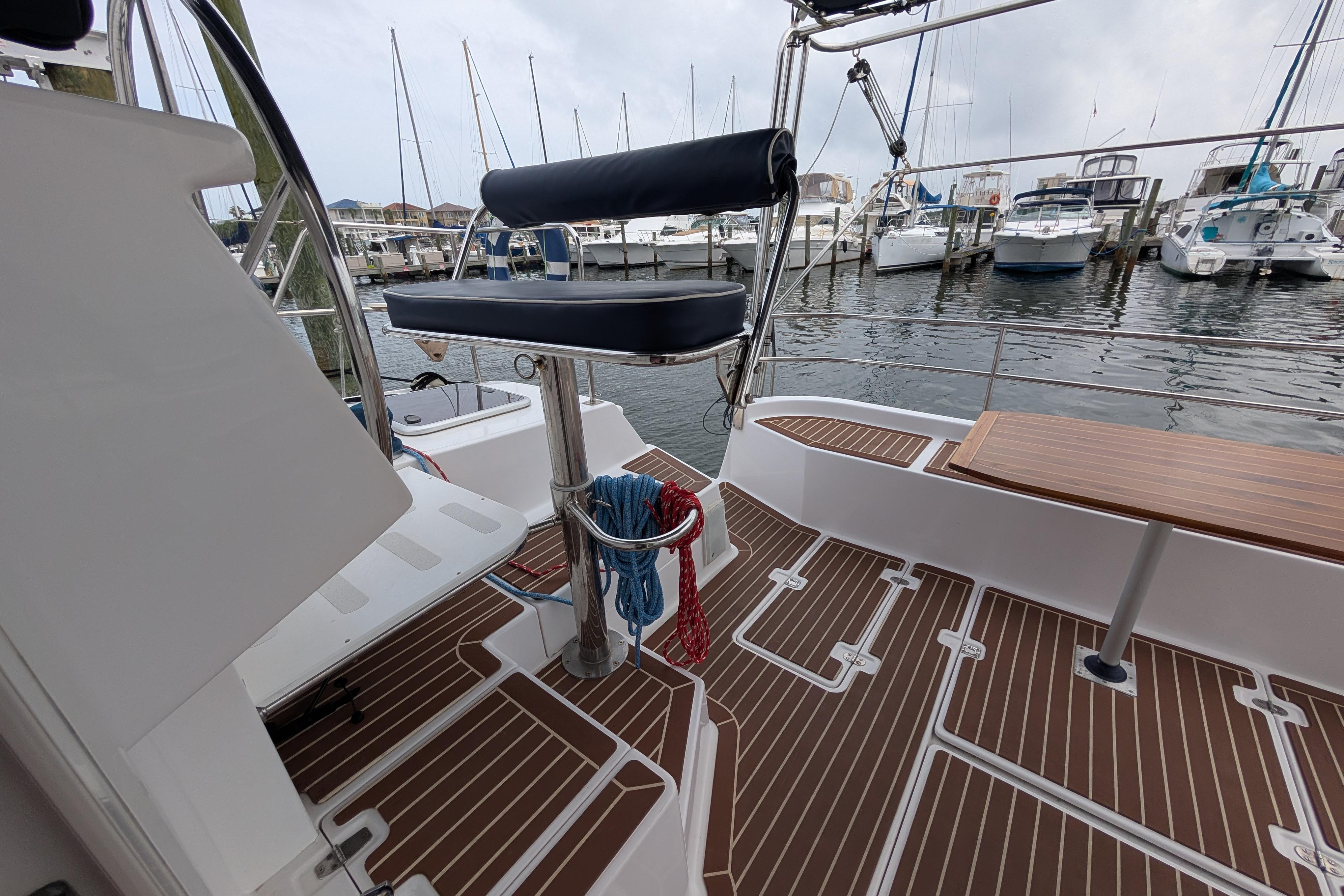 Cockpit view of 1999 Island Spirit 37 sailboat docked at marina.