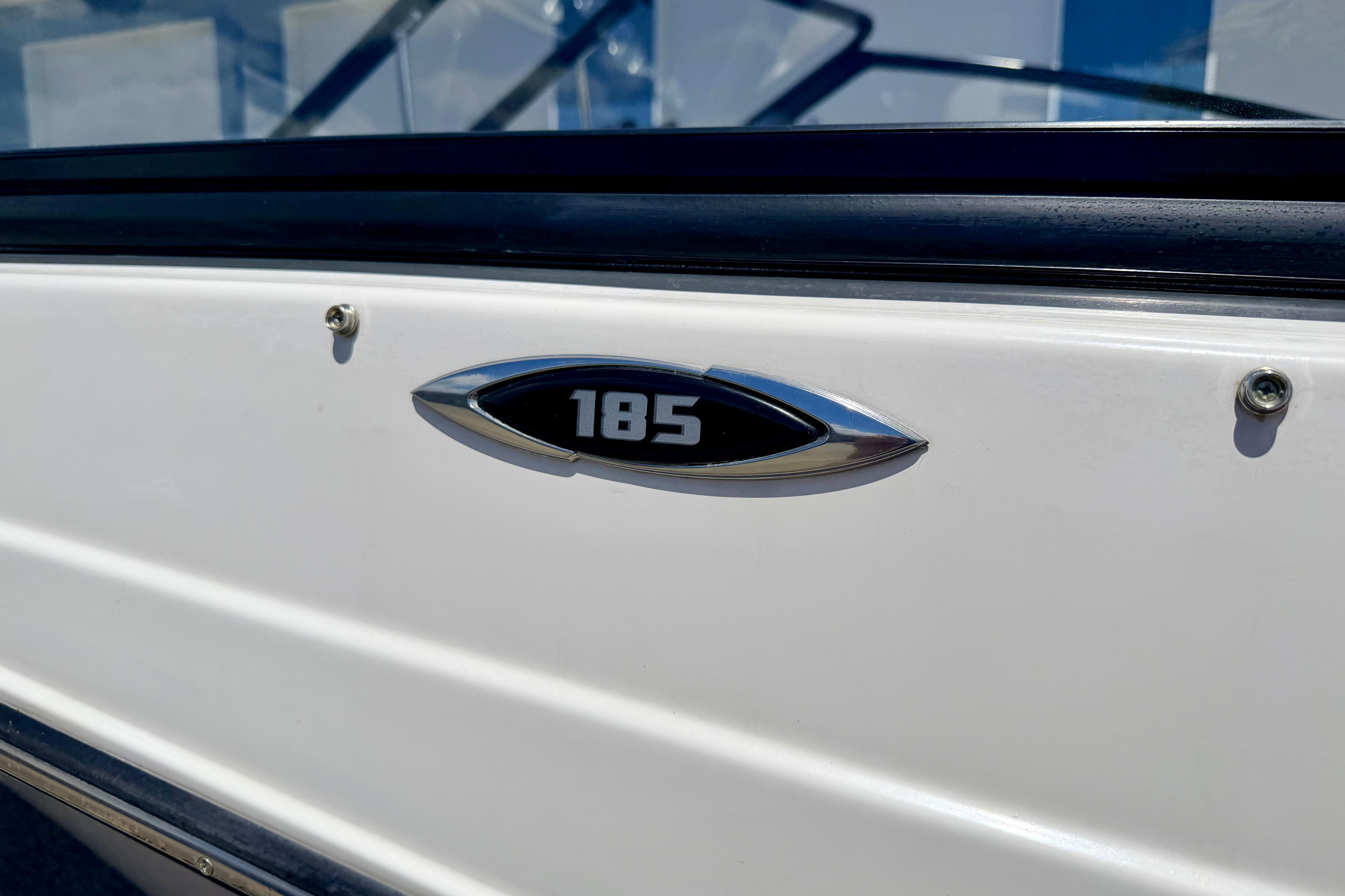 2018 Glastron GT 185 boat emblem on white exterior.