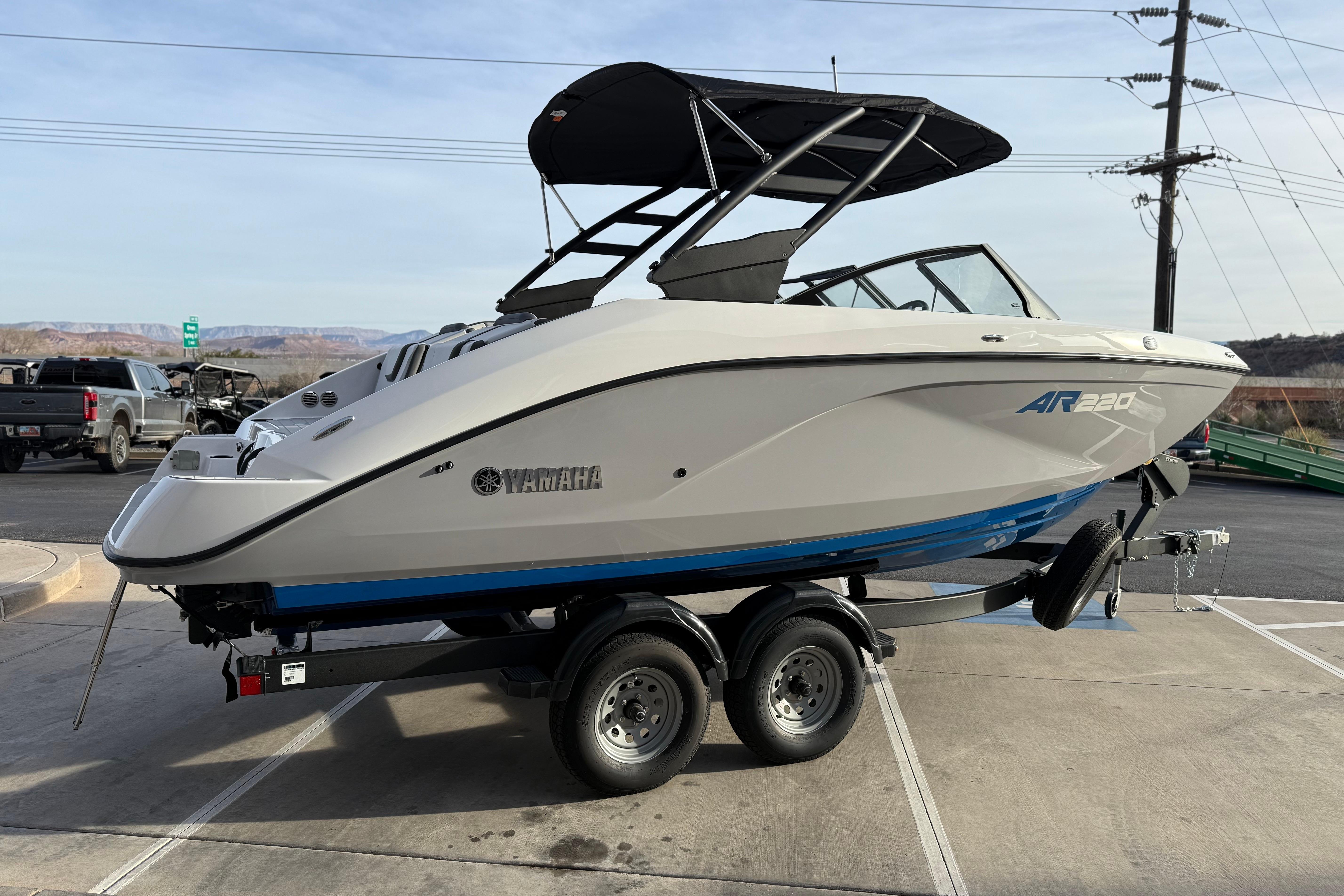 2026 Yamaha Boats AR220 on trailer, sleek design, parked outdoors.