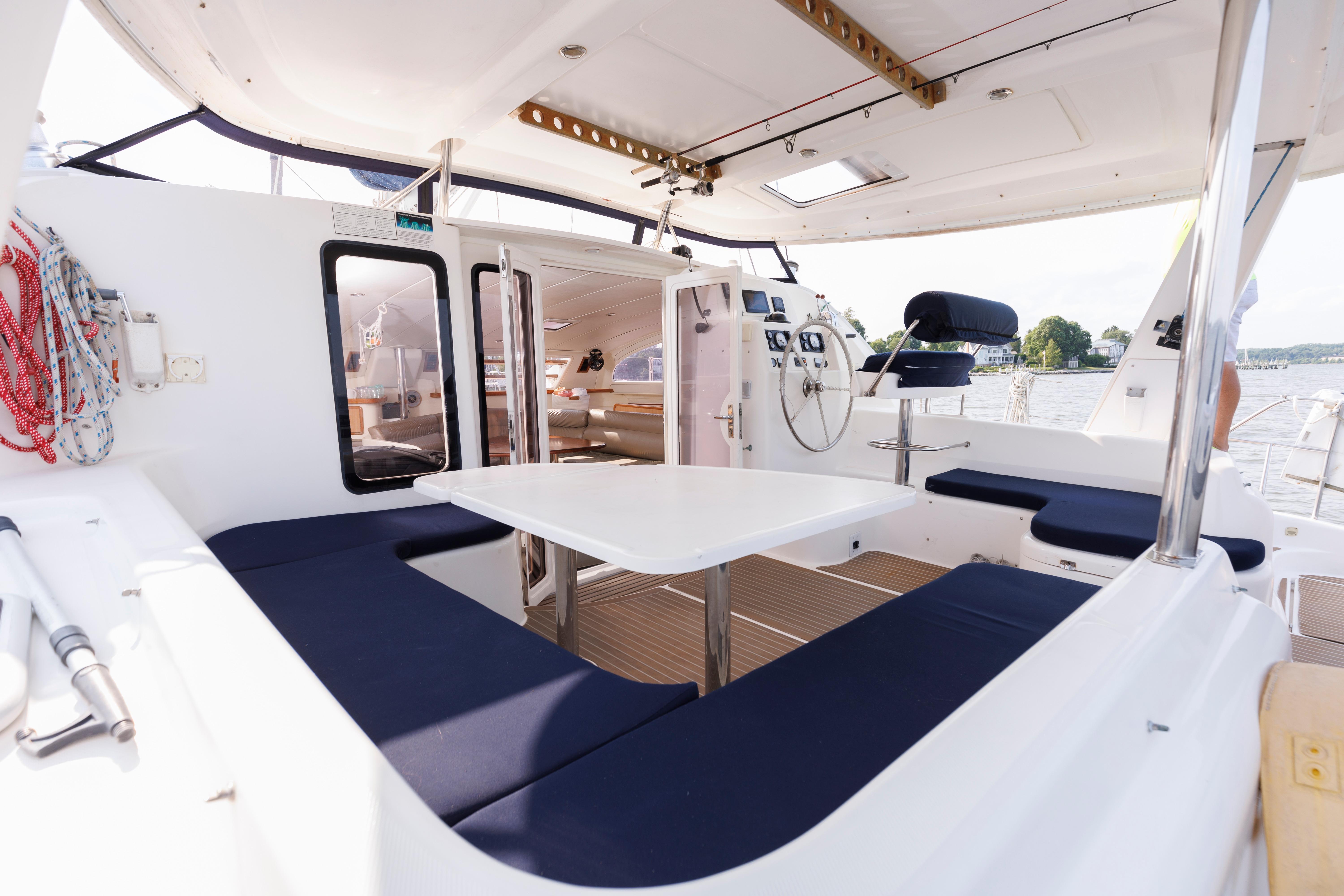 Spacious cockpit of a 2006 Leopard 43 catamaran with seating and navigation area.