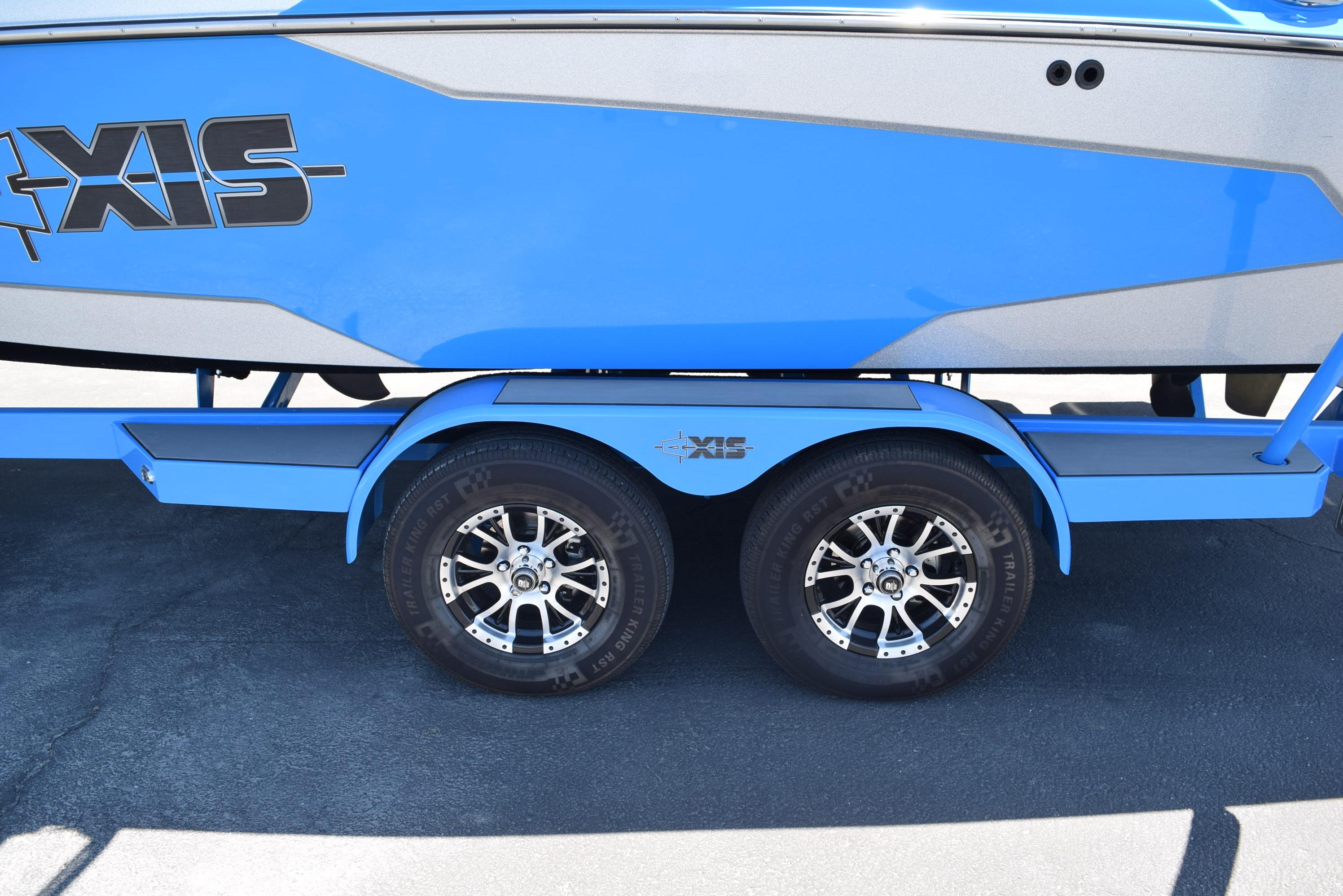 2019 Axis A22 boat on a blue trailer with dual wheels.