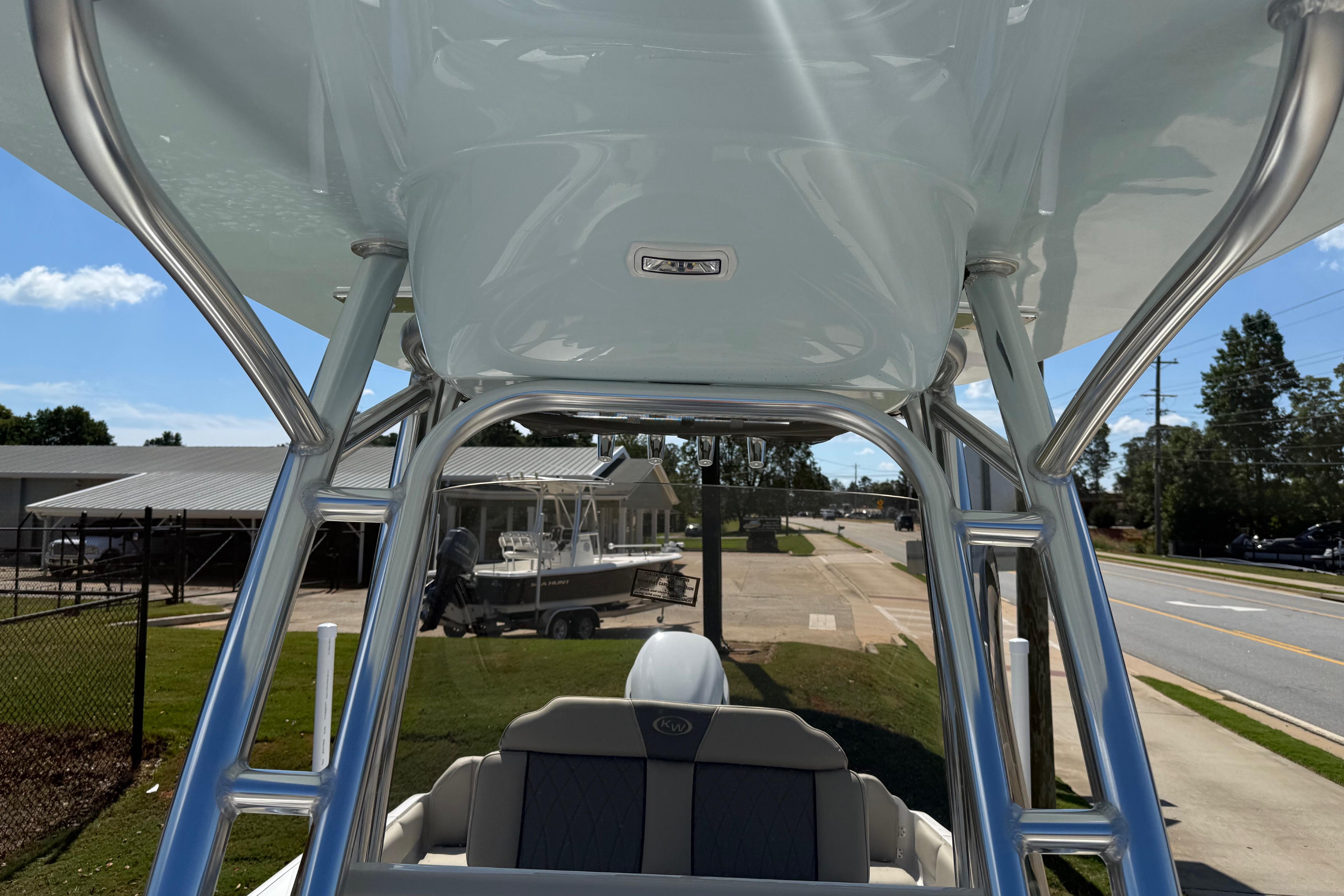 2026 Key West 239 FS boat with sleek T-top design and comfortable seating.